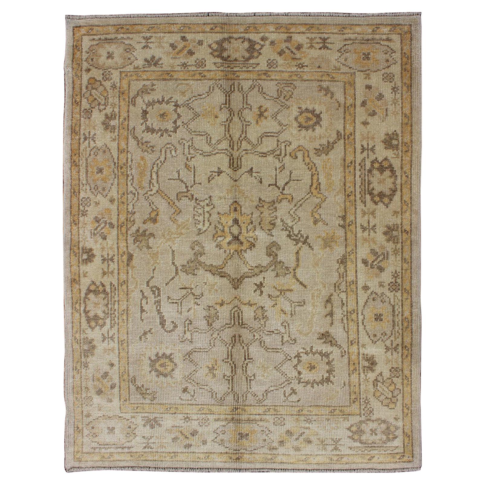 Reproduction Turkish Oushak Rug with Stylized Floral Design in Earth Tone Colors For Sale