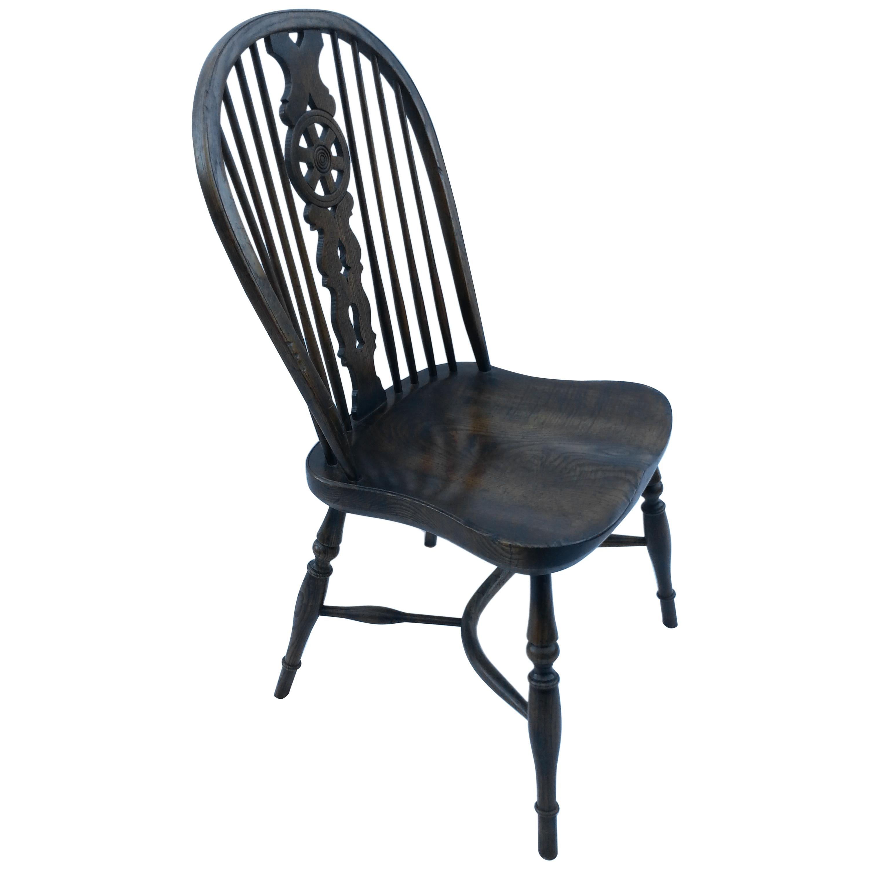 Reproduction Wheel Back Dark Stain Armless Chair For Sale