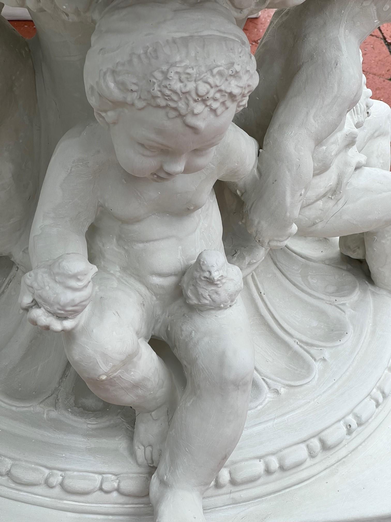 Molded Reproduction White Fiberglass Urn with Large Handles Grape Vines and Cherubs   For Sale