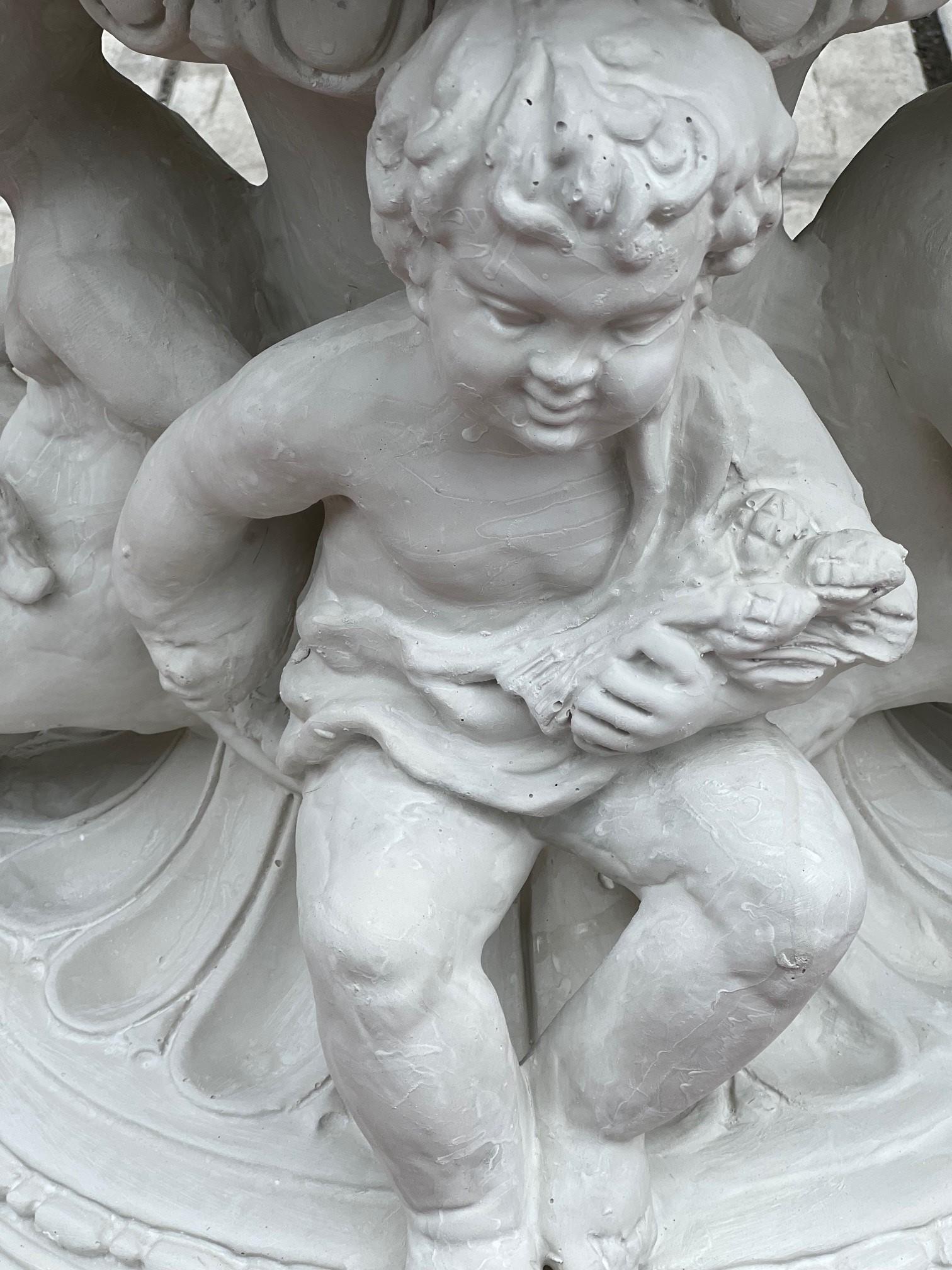 Contemporary Reproduction White Fiberglass Urn with Large Handles Grape Vines and Cherubs   For Sale