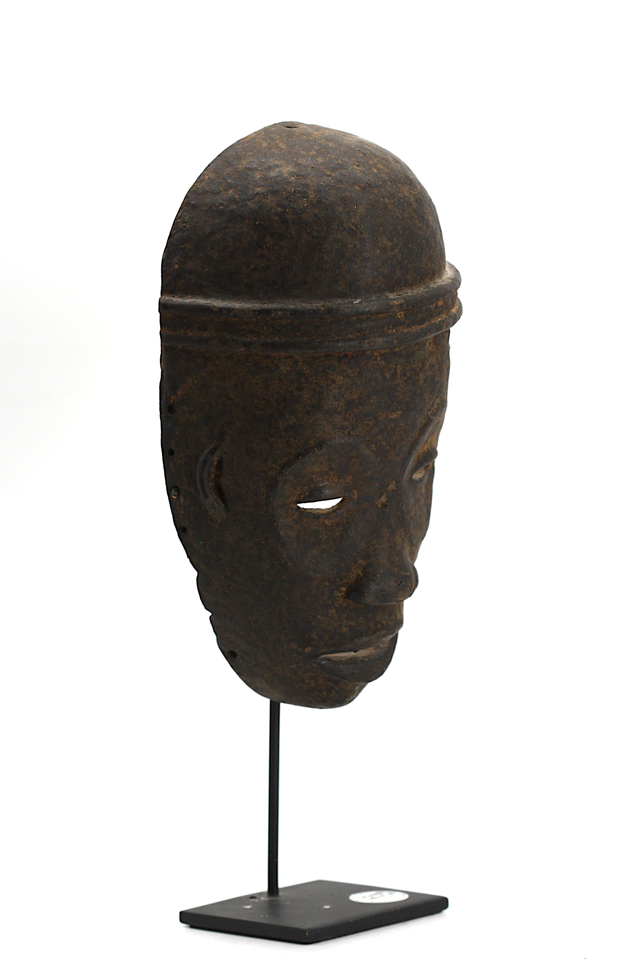 
Republic of Congo, Ceremonial Wood Dance Mask
Early 20th Century, on a metal stand.
Height 10 in. Width 6 in.