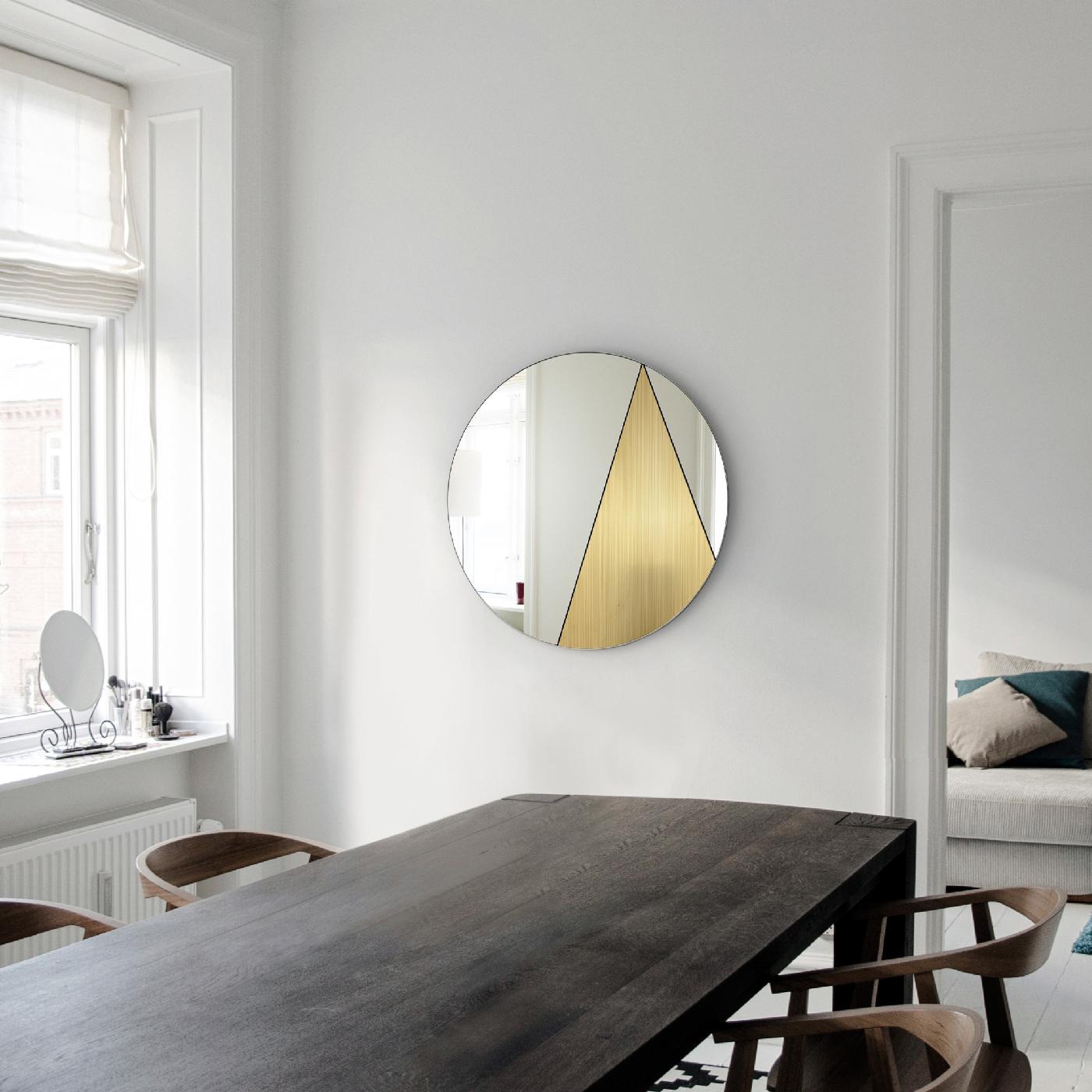 Mirrored surfaces and metals come together to reveal an abstract decoration enclosed in the round Silhouette of this stunning, handmade mirror from the Res Collection. Functional yet intriguing, this piece will make a statement in a contemporary