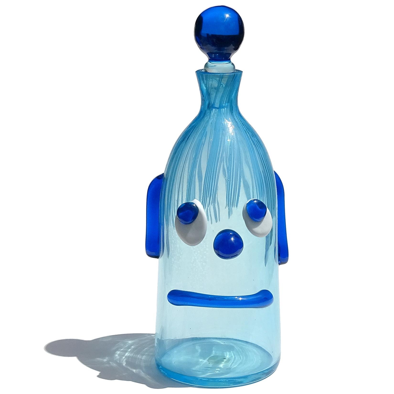 Reserved for Joey

Cute and unusual Murano hand blown blue Italian art glass decanter with clown face. Documented to the Fratelli Toso Company. It still retains a worn 