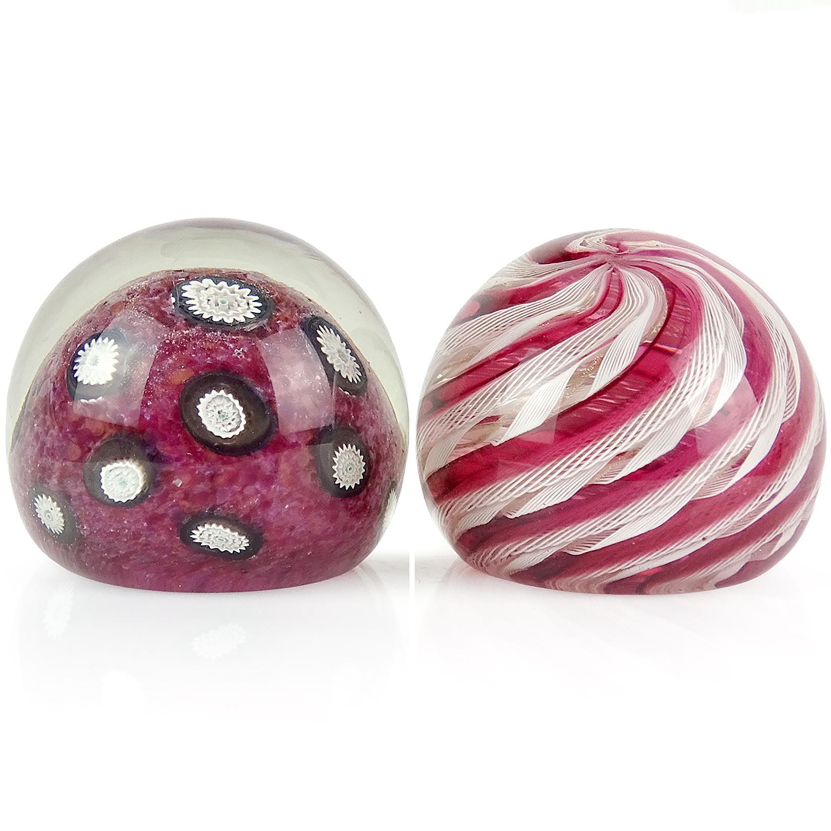 Reserved for Jamie

Beautiful Murano hand blown Italian art glass paperweights. Documented to the Fratelli Toso company. The first is a red dots ground with white and black millefiori flower pieces. Next, a white Zanfirico ribbons and clear red