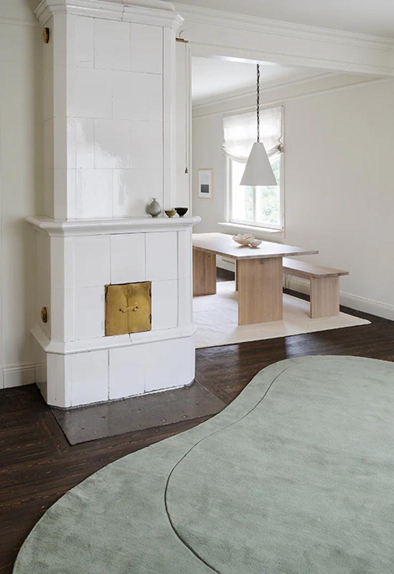 Residue Sage Rug is a unique, big rug with one organic stripe that makes a difference in the height. With its structured wool and the high and low cut, Residue can be an art piece to the room but at the same time, fulfill its functions as a rug. The