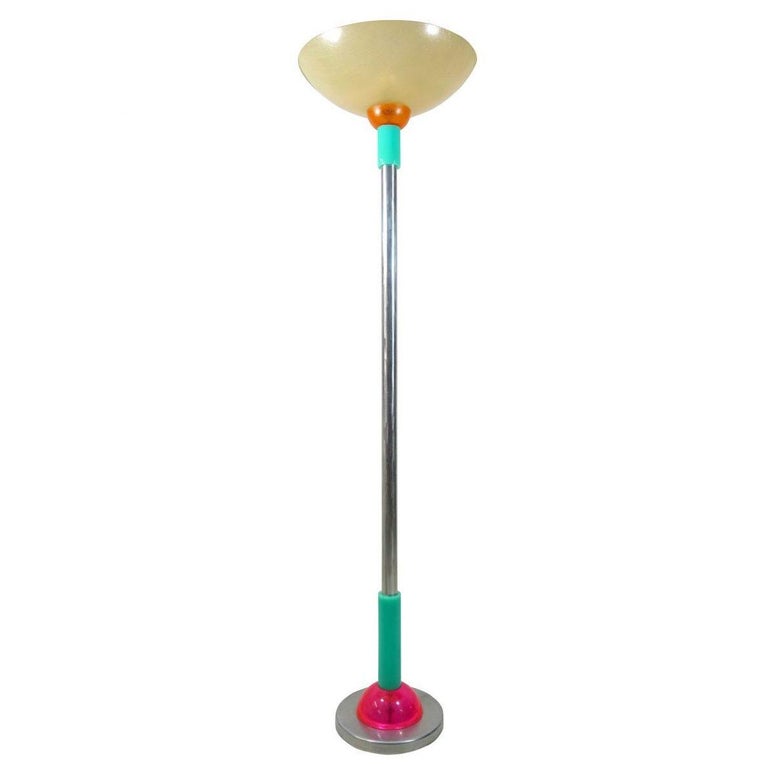 American artist Steve Zoller is unique in his use of color, elemental shapes and flamboyant style. In 1993 he made this beautiful floor lamp together with a table lamp, a sconce and two flower vases in the same luxurious style. On its chrome base
