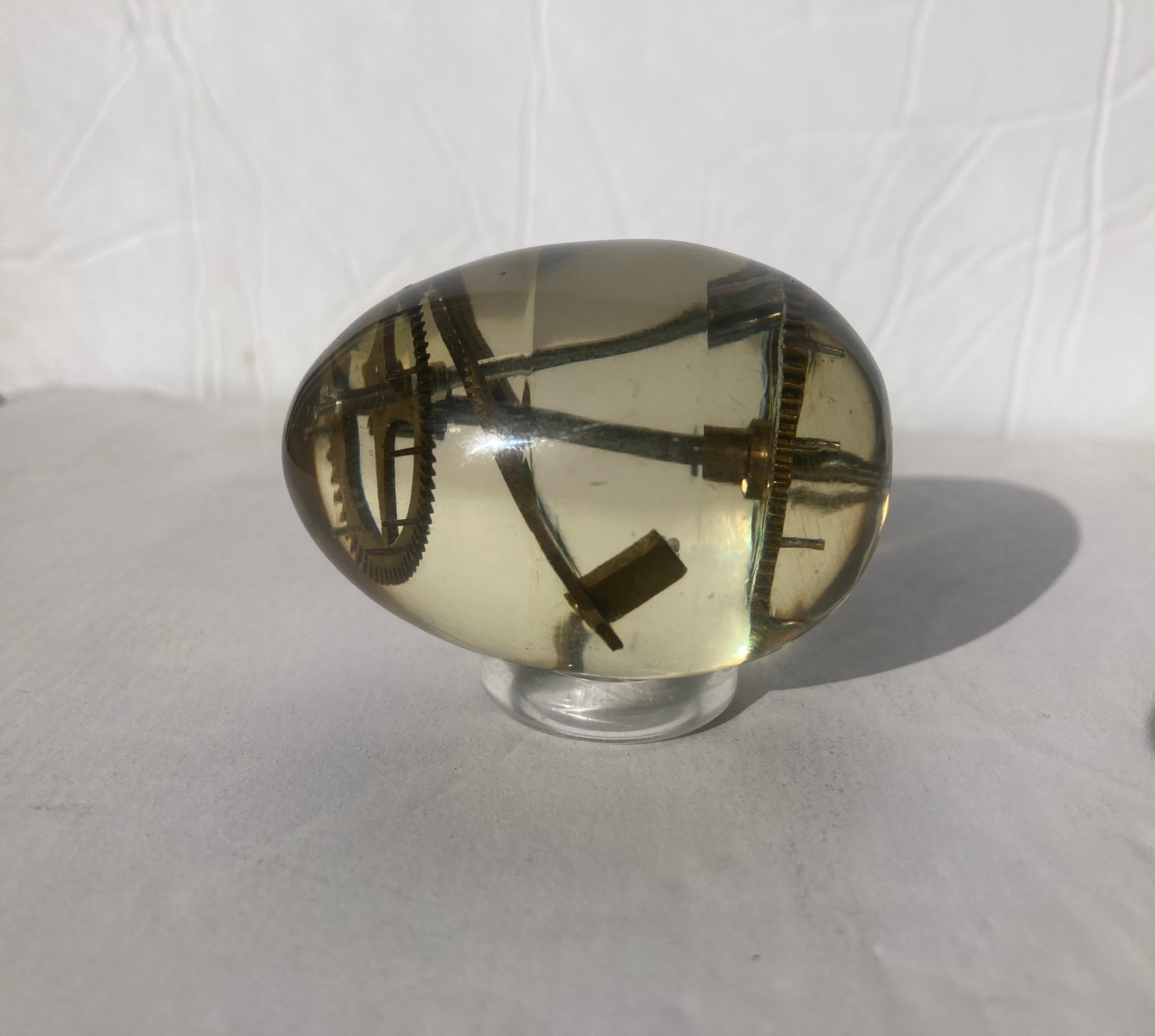 Beautiful resin egg with clock parts inside, remind us to some the resin Oierre Giraudon , the resin is coloring with age.