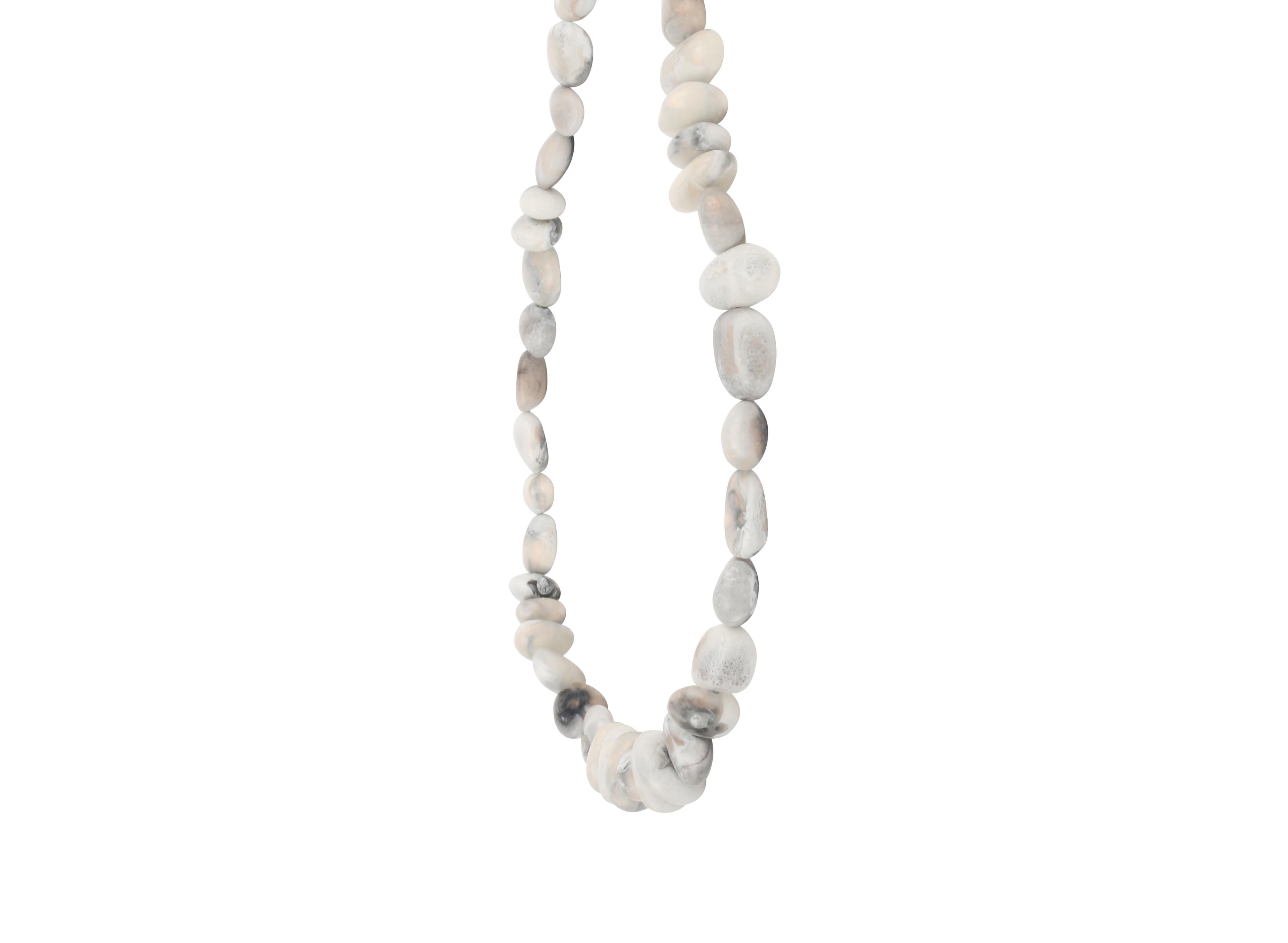 Resin beaded necklace with silver detailing. This necklace is featured in our Classic colour, Sandy Pearl. 

Dinosaur Designs resin products are hand made in Sydney, Australia. Each piece is unique and we cannot guarantee you will receive an item