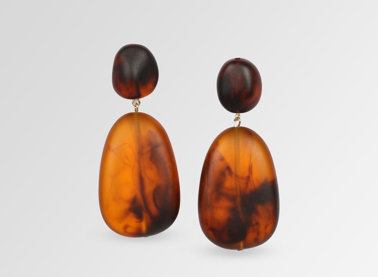 Resin drop earrings with surgical steel studs. These earrings are featured in our Classic colour, Tortoiseshell. 

Dinosaur Designs resin products are hand made in Sydney, Australia. Each piece is unique and we cannot guarantee you will receive an