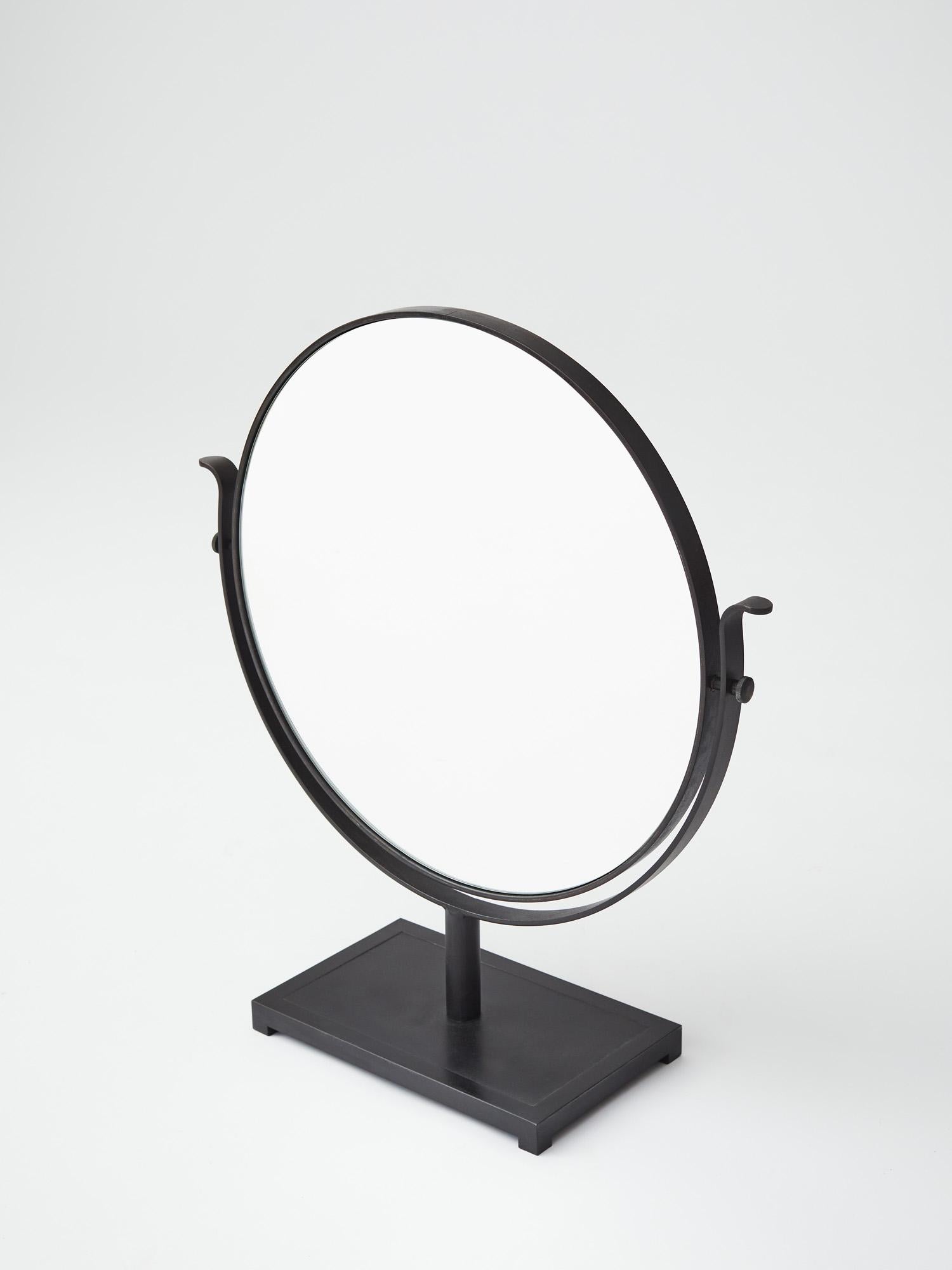 Resize table mirror in steel burned in linseed oil. Designed by Lousie Liljencrantz, Interior Designer based in Stockholm, Sweden.

Made in Stockholm, Sweden.