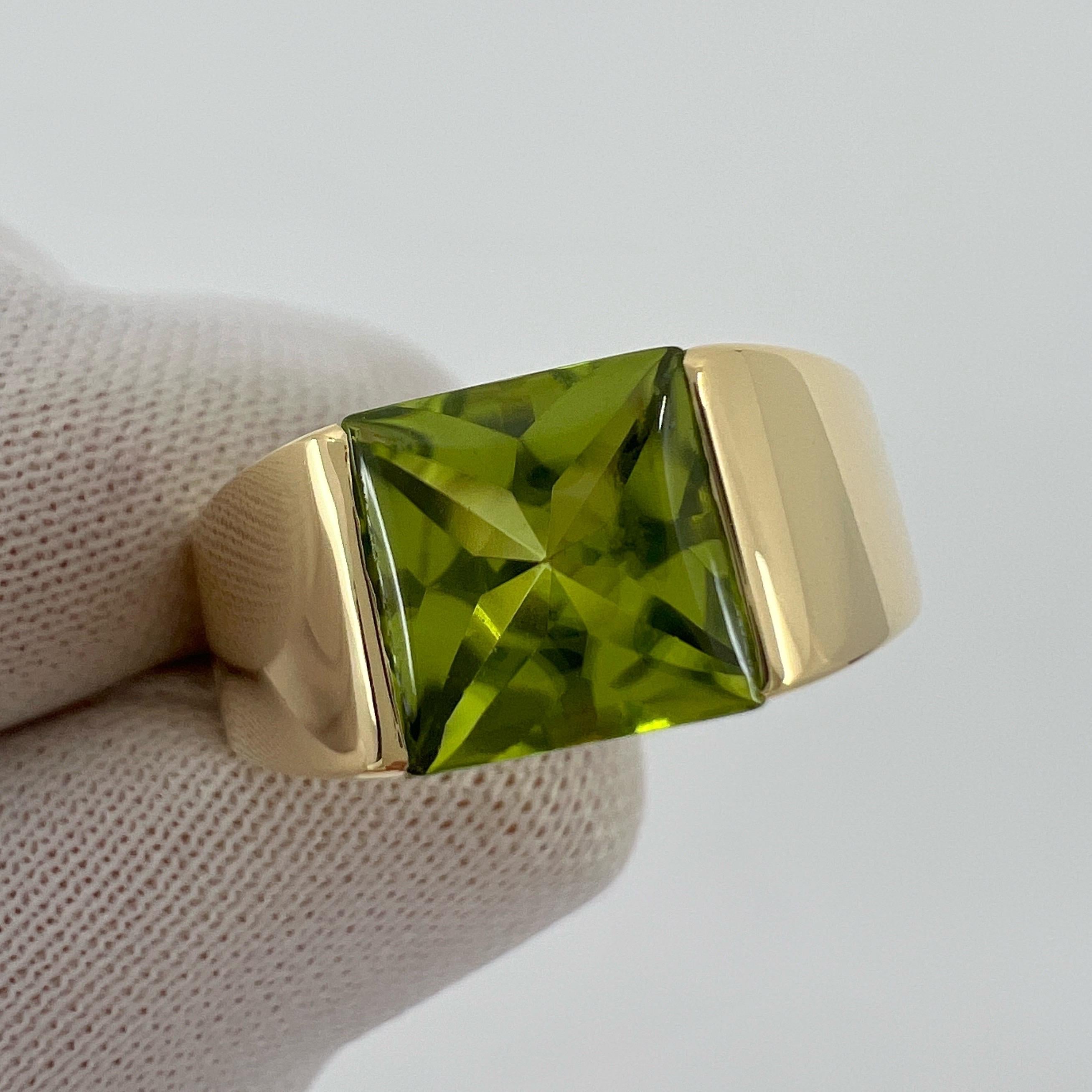 RESIZING CHARGE NOT ITEM
TO RESIZE TO US 8 - RESIZED RINGS ARE NOT REFUNDABLE 

Rare Vintage Cartier Vivid Green Peridot 18k Yellow Gold Tank Band Ring.

Stunning yellow gold ring with a large 8mm tension set vivid green peridot. 

Fine jewellery
