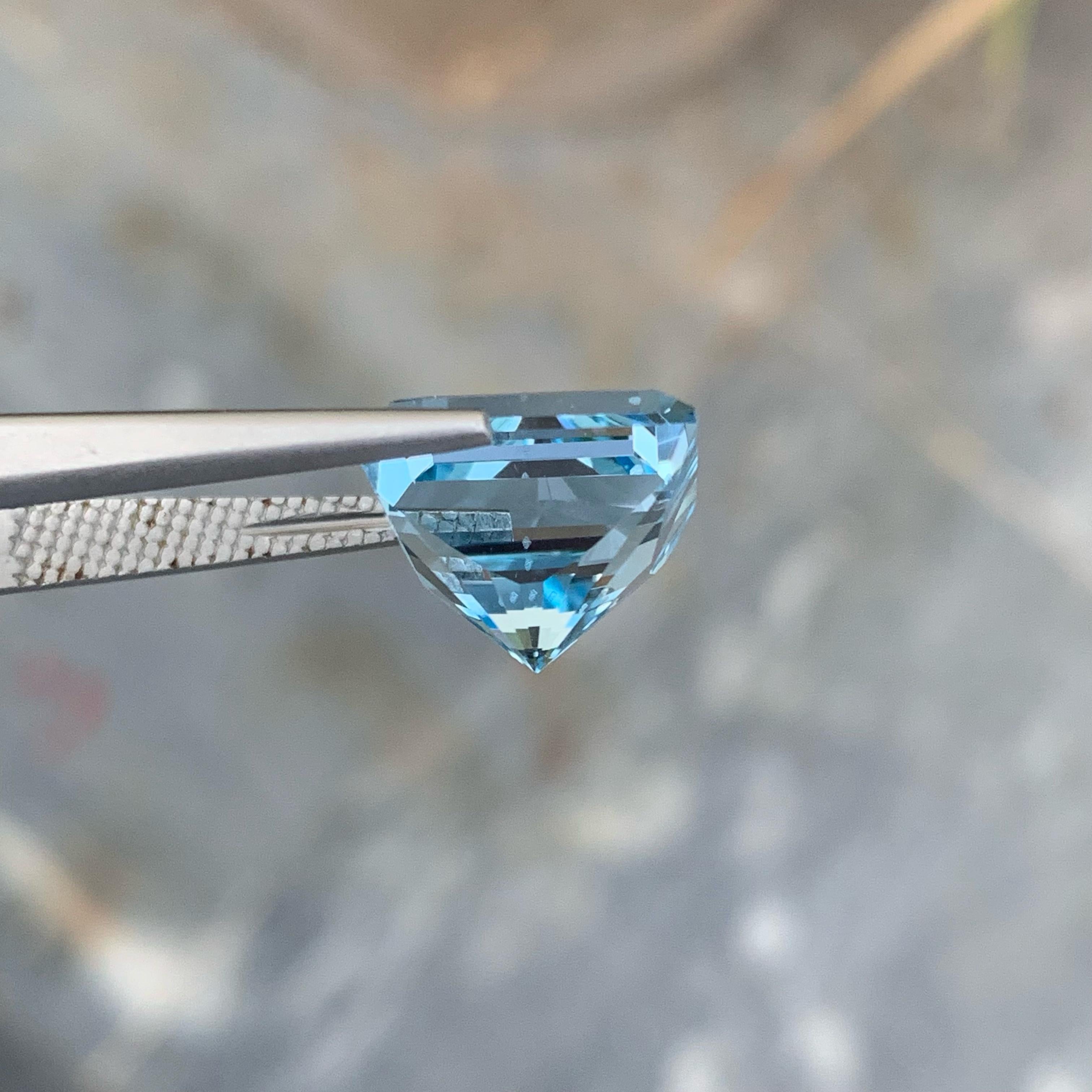 Weight 12.15 carats 
Dimensions 12.5 x 11.2 x 9.9 mm
Treatment Heated 
Origin Madagascar 
Clarity VVS (Very, Very Slightly Included)
Shape Rectangular 
Cut Custom Precision


Discover the captivating allure of a custom precision-cut Blue Topaz,