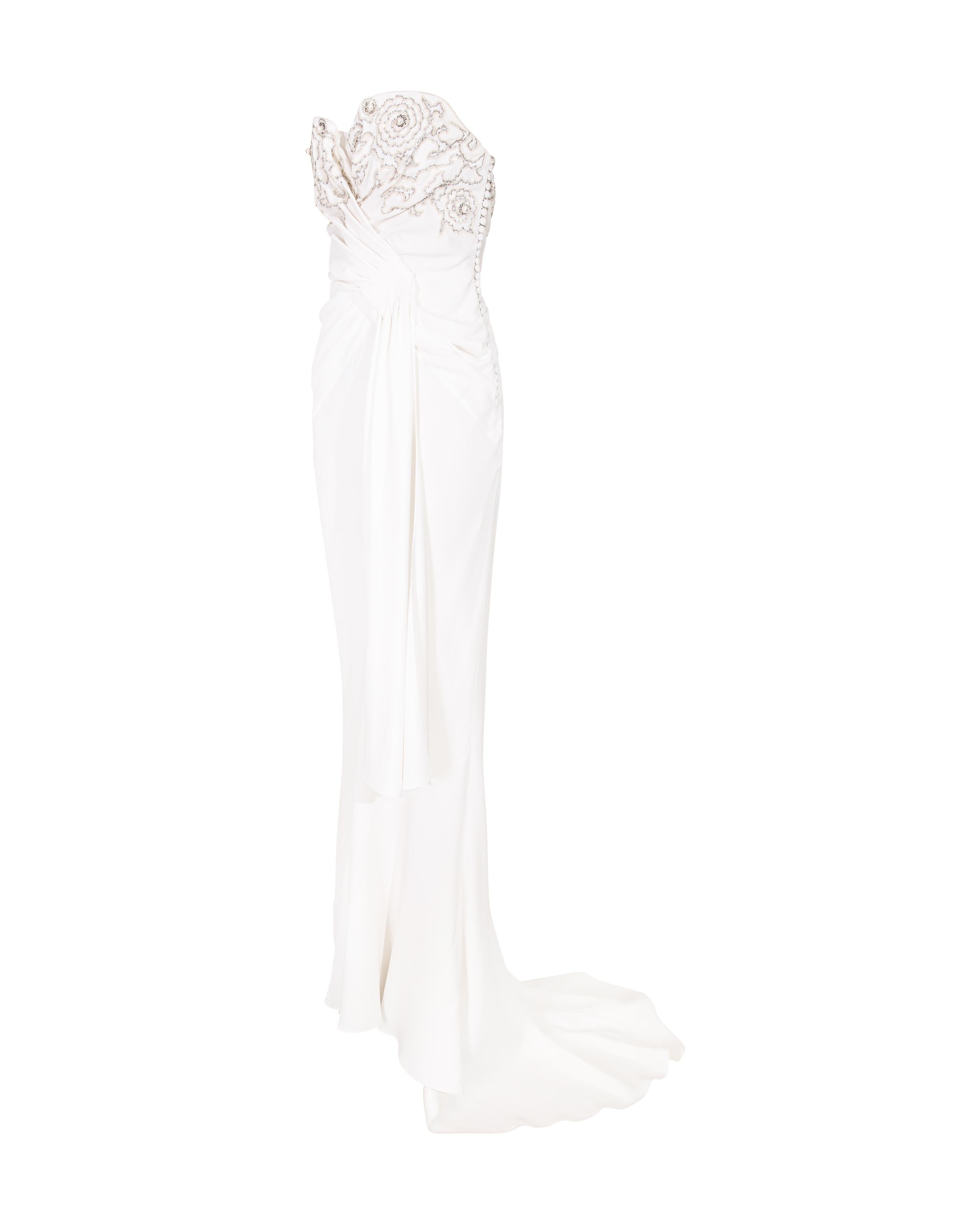 Resort 2008 Christian Dior by John Galliano embroidered white strapless gown with glass beaded embellishments. Fitted strapless mermaid style gown with moderate train, featuring silver-tone and warm pearl floral motif embellishments at bust.