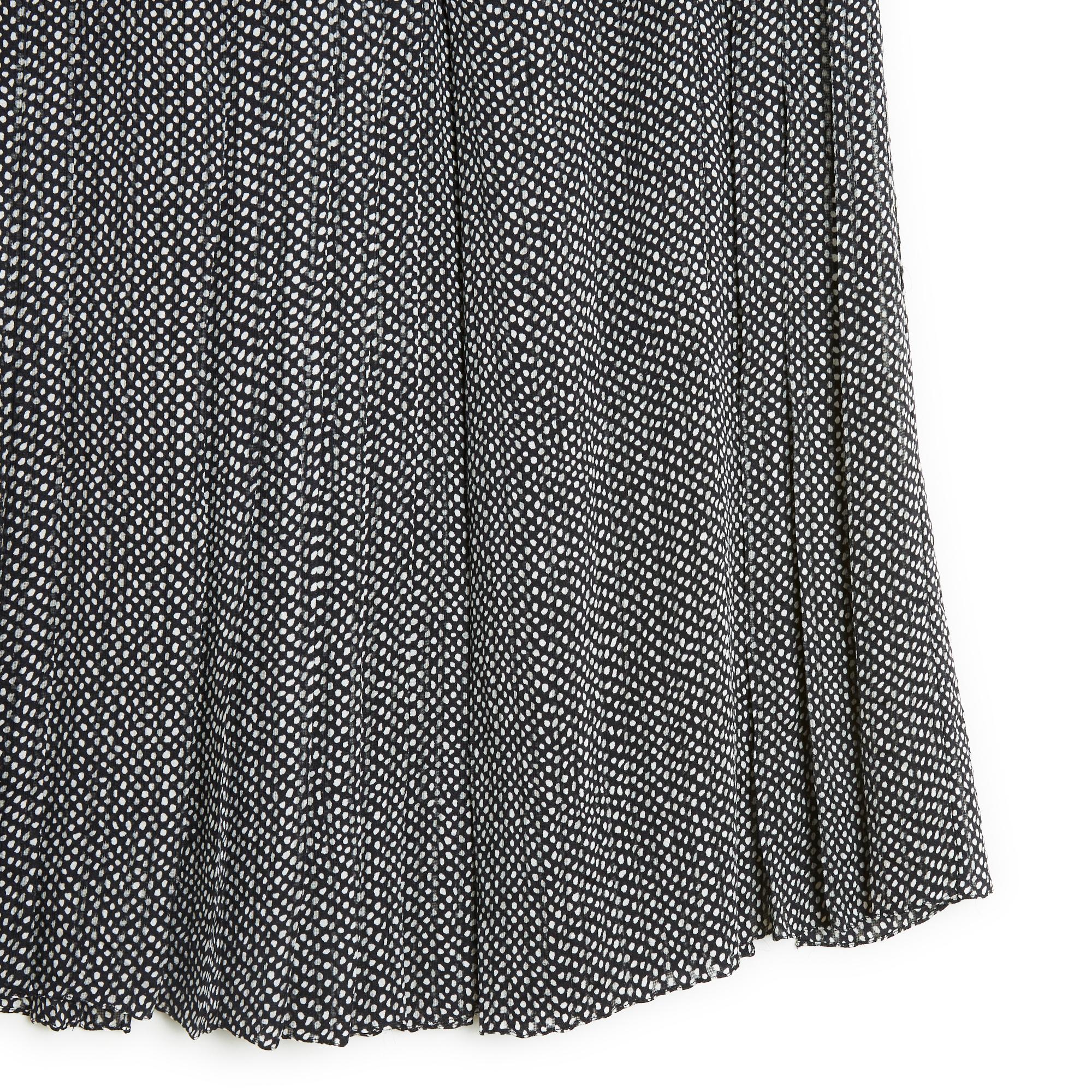 Céline skirt from Cruise 2011 collection by Phoebe Philo, high waist, in black silk chiffon with irregular white polka dots, alternating pleats at the front and large hollow pleats at the back (smoother at the back than at the front), closing with a