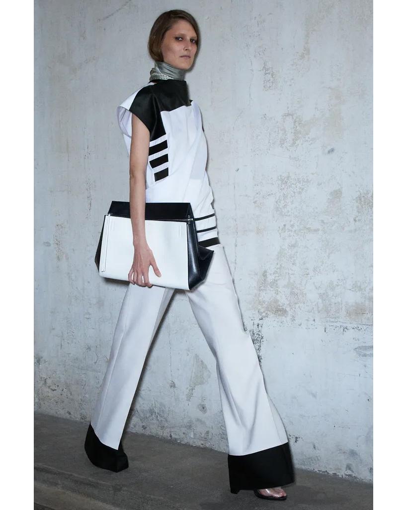 Resort 2013 Old Céline by Phoebe Philo white and black color block trousers. Classic high waisted trousers with black color block trim at hem. As seen in the lookbook (Look 16). Fabric Composition: 72% Wool; 28% Silk. In very good vintage condition