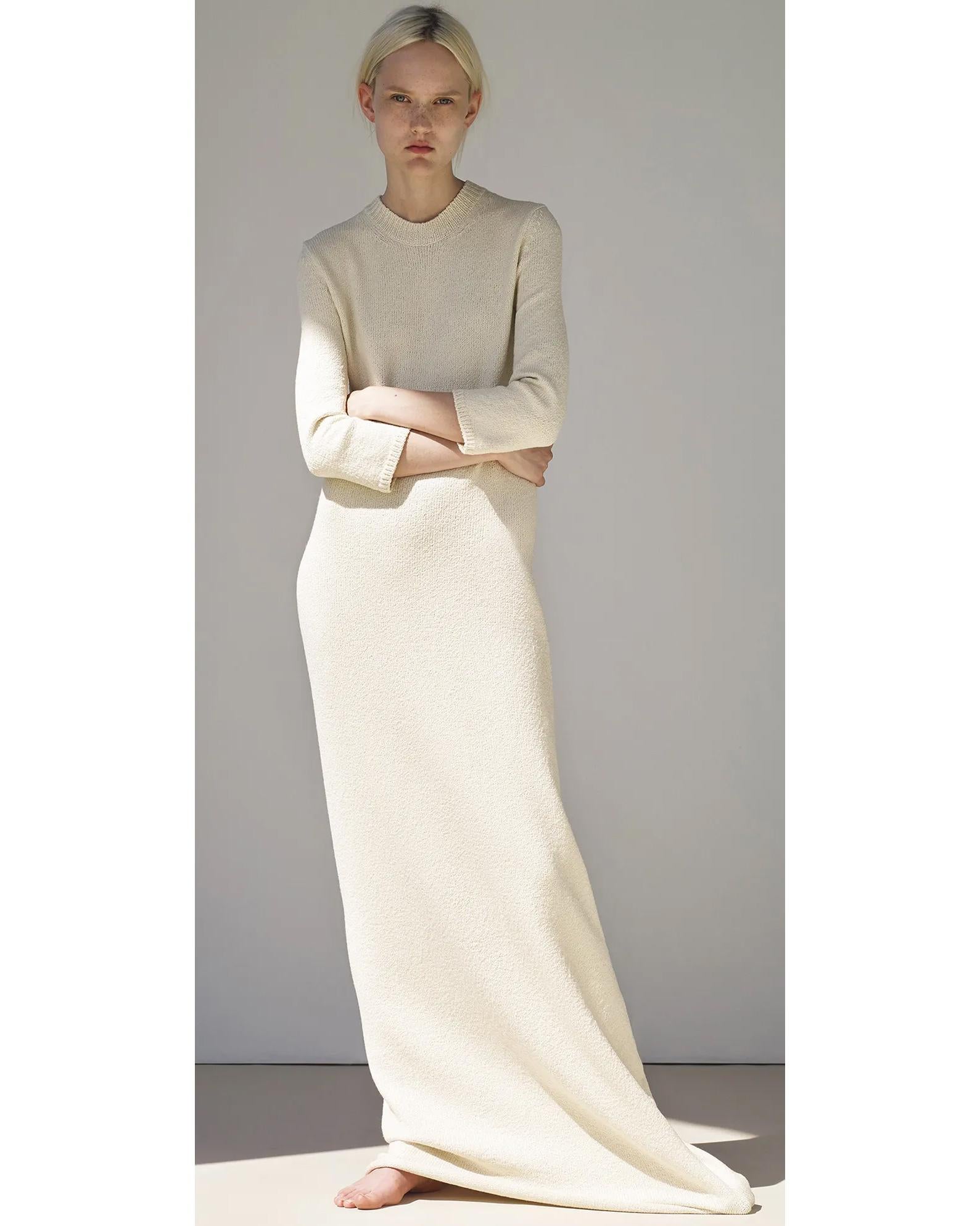 Resort 2015 Céline by Phoebe Philo wool blend scoop neck cream knit dress. Long scoop neck boucle knit dress with three-quarter sleeves and open slit at back hem. Has minor stretch that can accommodate a range of sizes depending on desired fit.