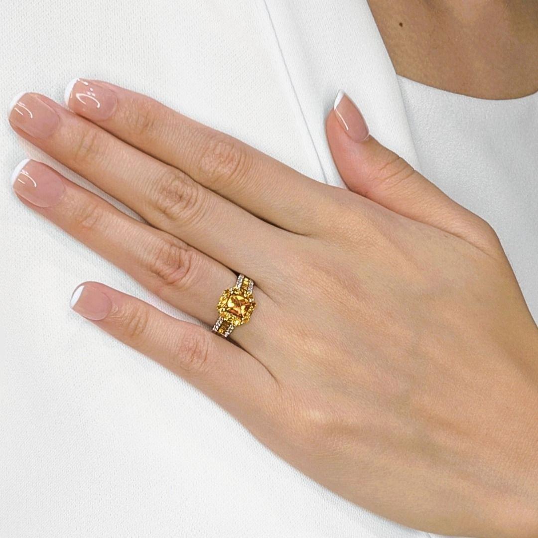 Adorn your hand with this truly beautiful 18K yellow gold ring, a vibrant celebration of color and sparkle. At its heart lies a magnificent 1.18ct cushion-cut natural citrine, glowing with a rich, warm orange hue that captures the essence of