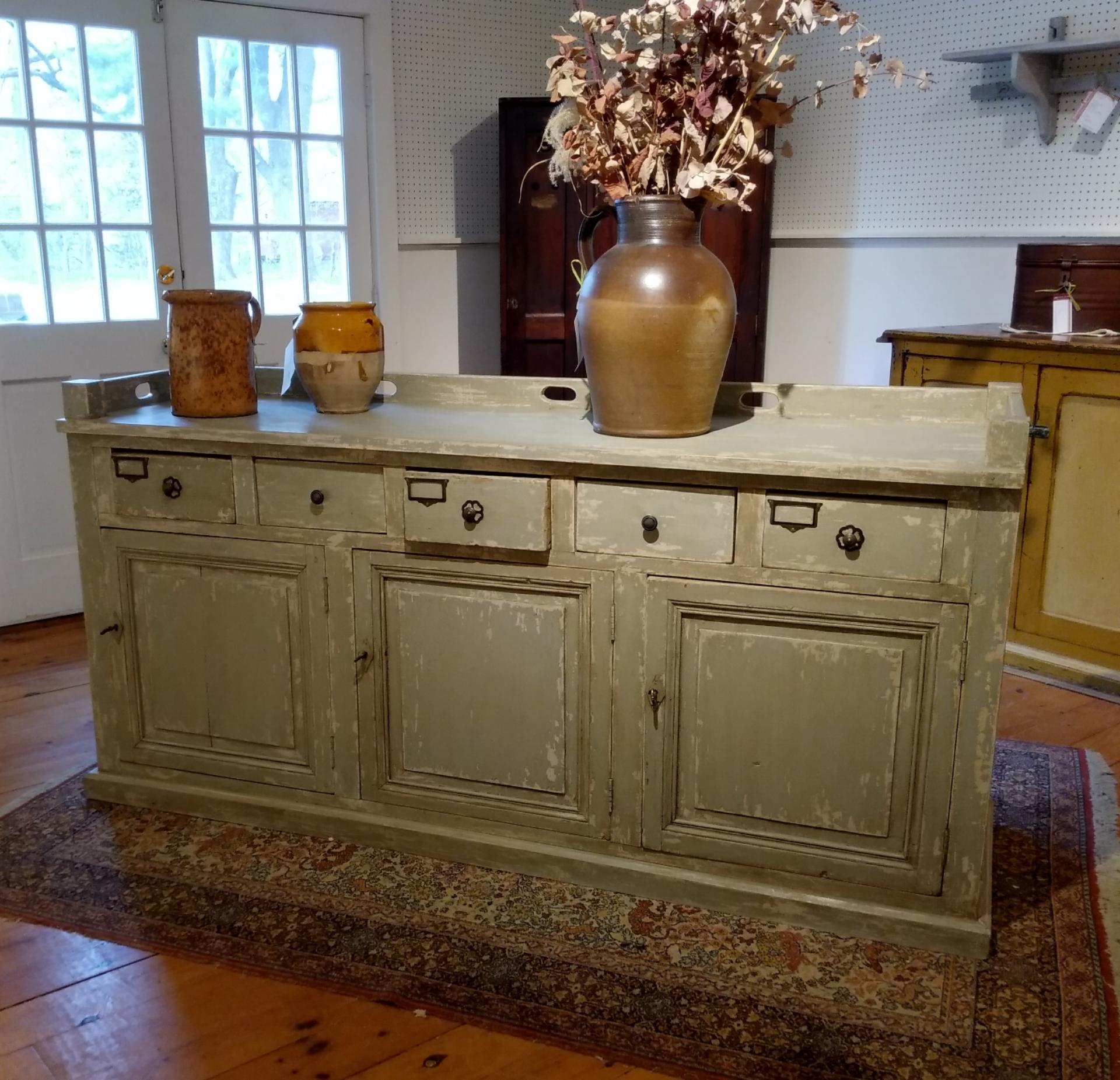 We by more store counters than anything in the store and this piece, from a French restaurant in the south of France is as special as any piece we have found in the last 3 years. There are three doors and five drawers on this piece. The three doors