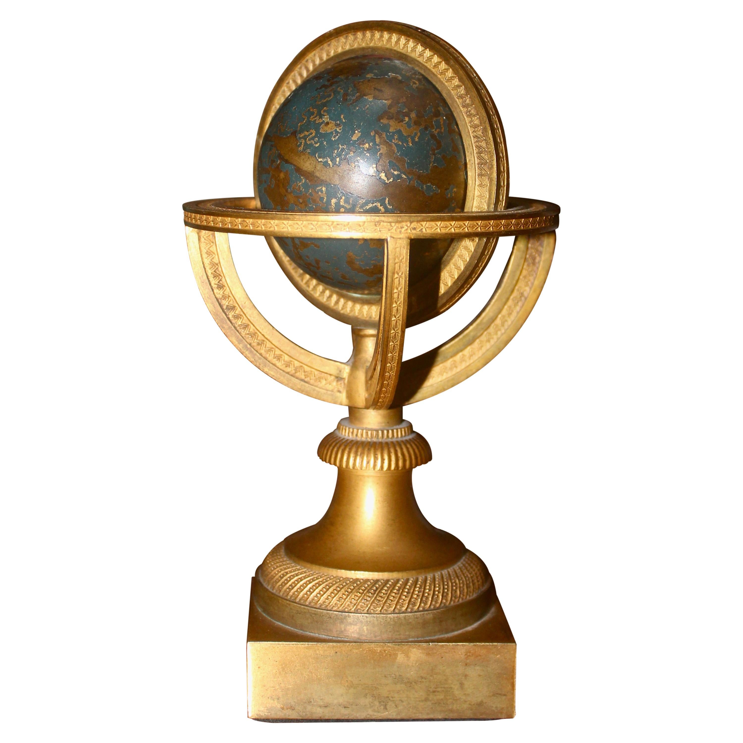 Restauration Gilded and Epargne Armillary Sphere and Paperweight, circa 1830