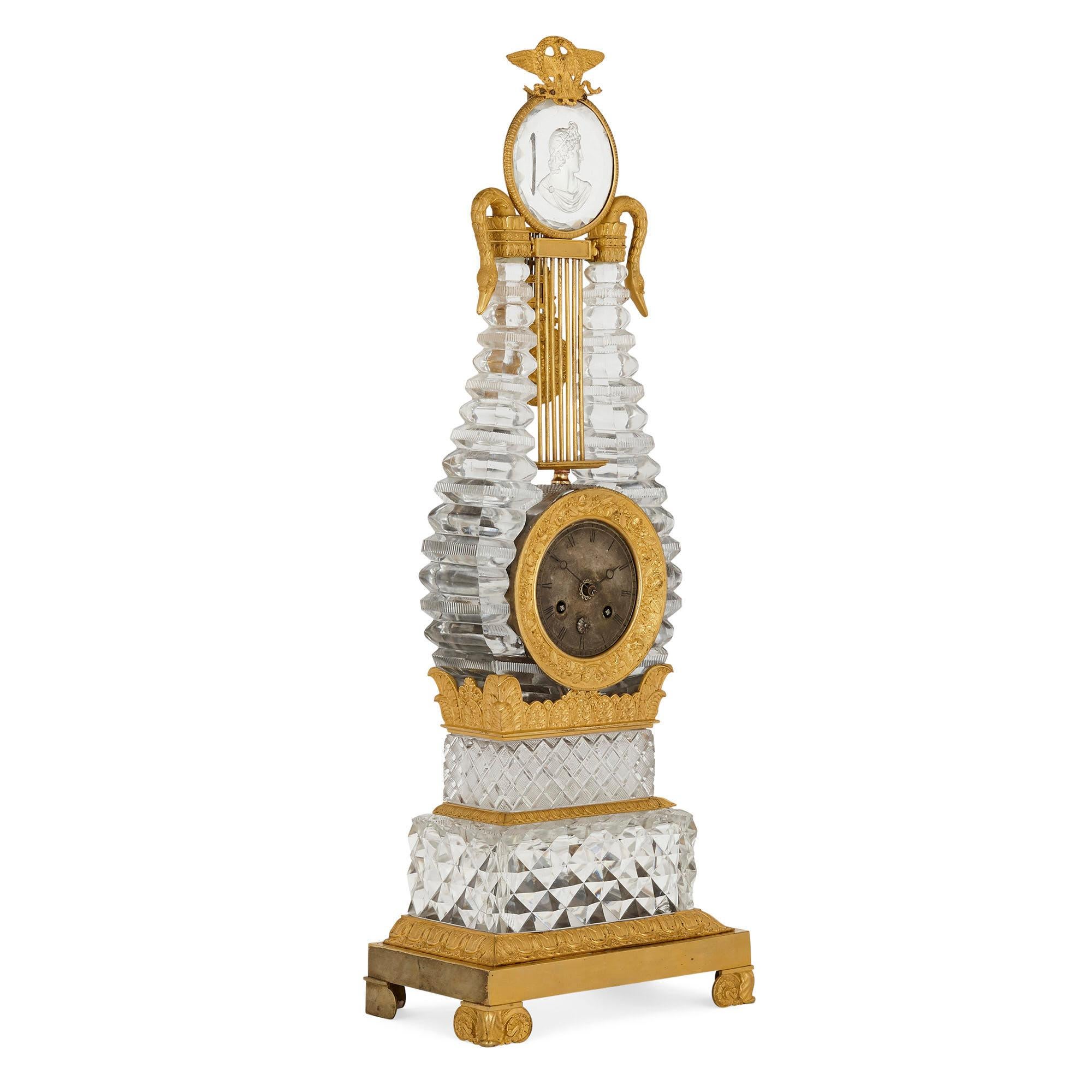 Restauration gilt bronze mounted crystal lyre mantel clock
French, circa 1820
Measures: Height 67cm, width 23cm, depth 14cm

This superb mantel clock takes the form of a classical lyre. The clock, which is crafted from cut crystal mounted with