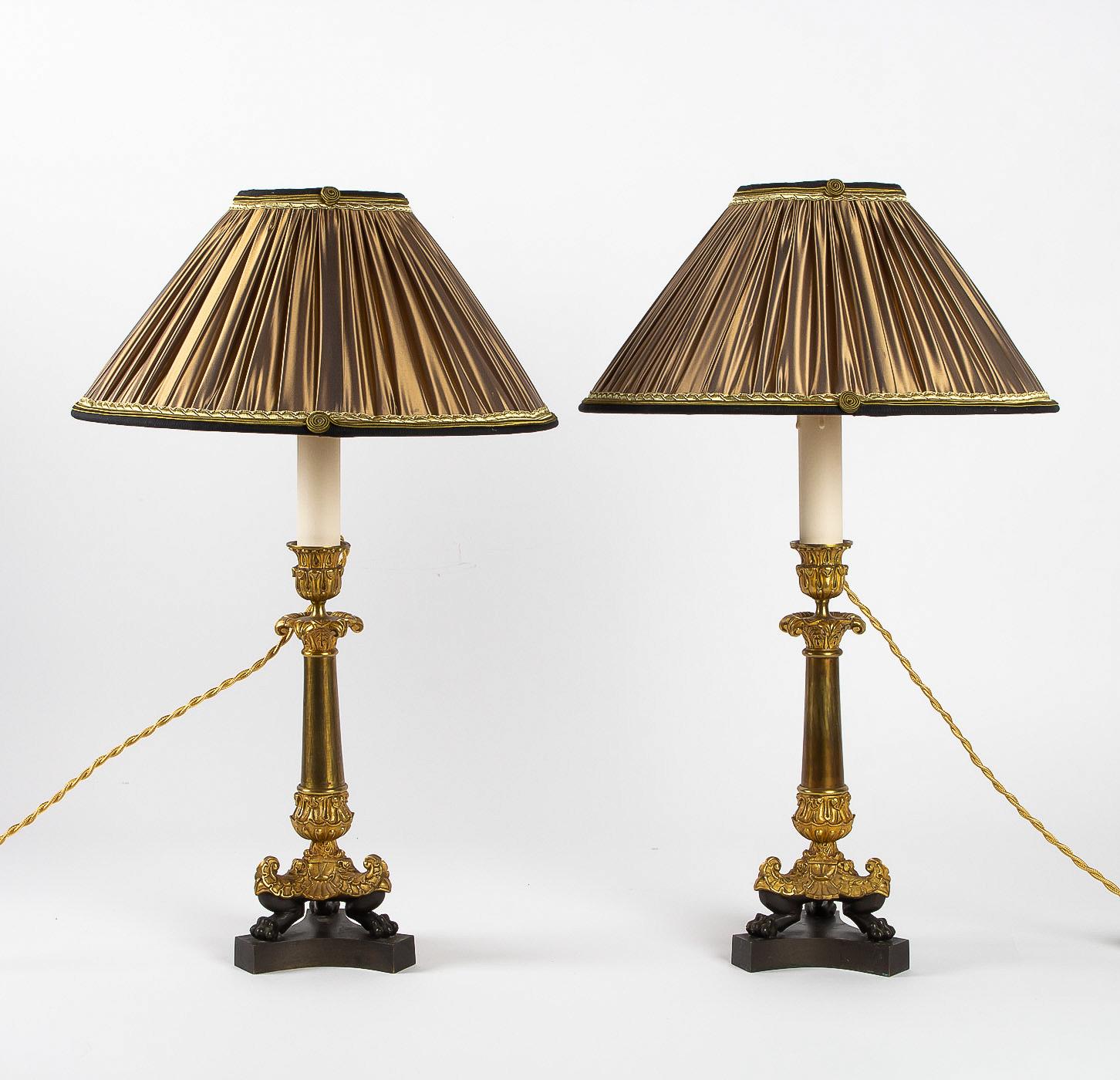 French Restoration period, converted in table lamps, pair of small bronze candlesticks.

An elegant et decorative pair of small chiseled gilt and patinated bronze candlesticks. Original gilt. Lovely antique chiseled decoration with Acanthus leaves