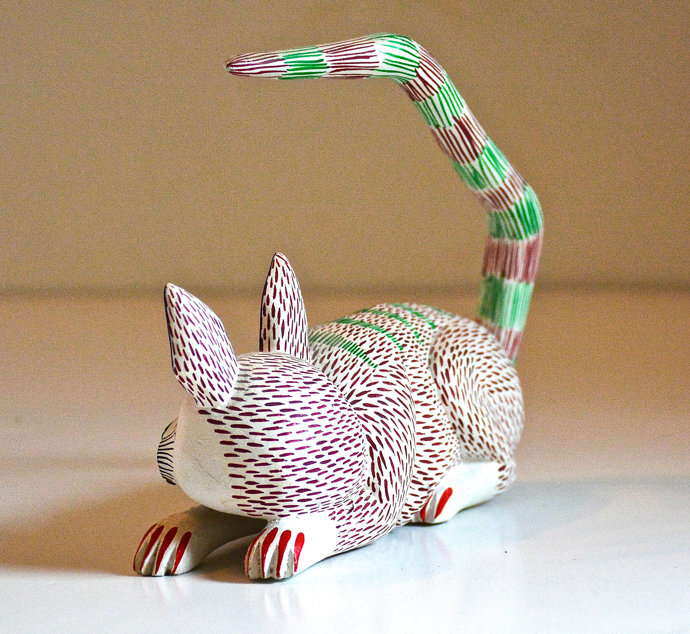 Resting Cat, 1989
Miguel Santiago Soriano
San Antonio Arrazola, Oaxaca, Mexico
Copal wood, acrylic paint
Signed and dated

Graceful elegant cat created by Master Carver Miguel Santiago in 1989. 

Miguel first began carving in 1985 and this wonderful