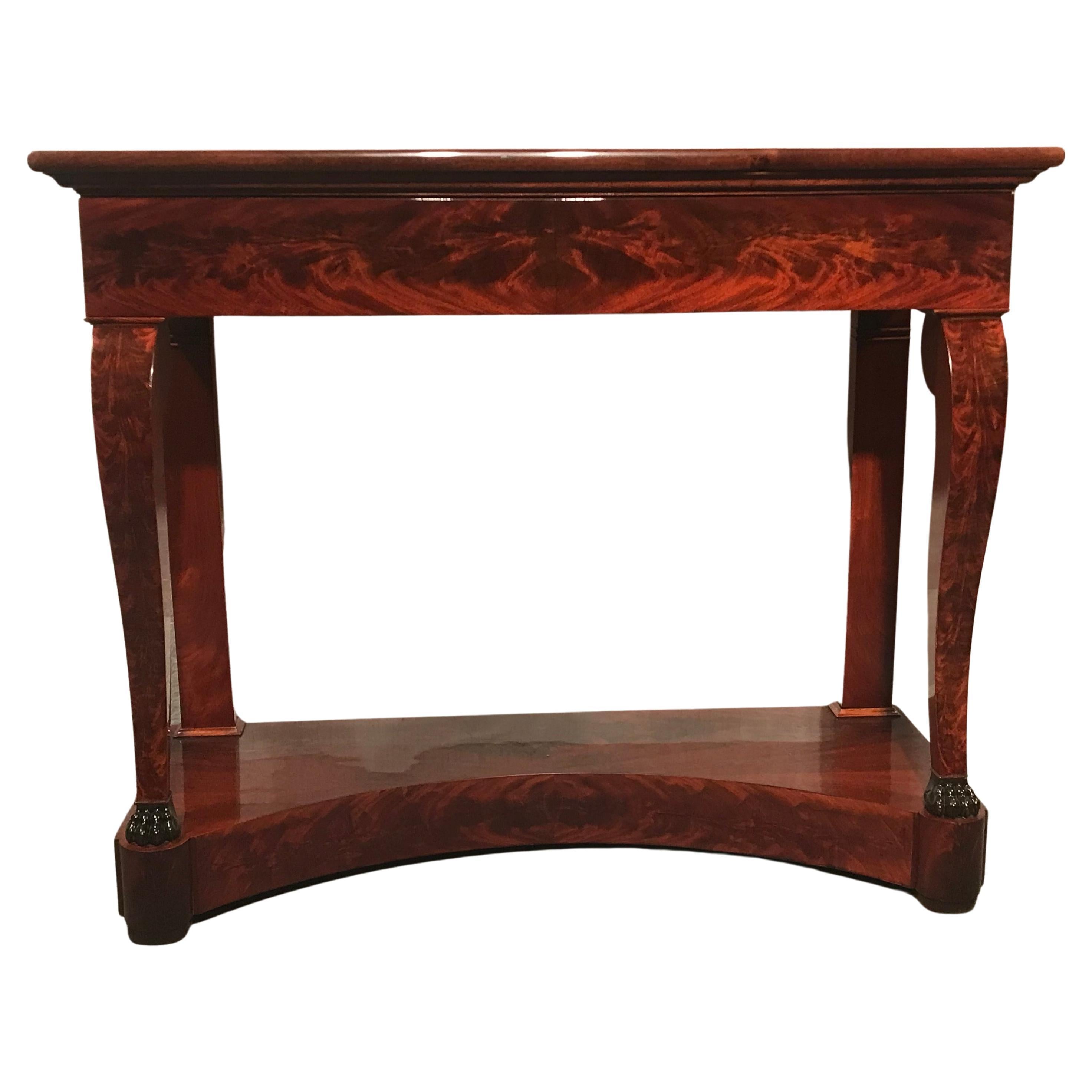 This elegant yet unpretentious French antique console table of the 19th century is a typical example of the French Restoration period. This was the period following the reign of Napoleon.
The console table has in-curving square-section legs with