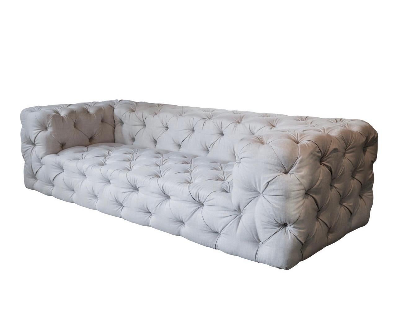 Large nine foot RH Soho fully tufted chesterfield sofa. Very good condition save for one on the armrest. Features squared off lines, low profile, and a sleek contemporary design that has made this piece one of RH's most sought after and, hence,