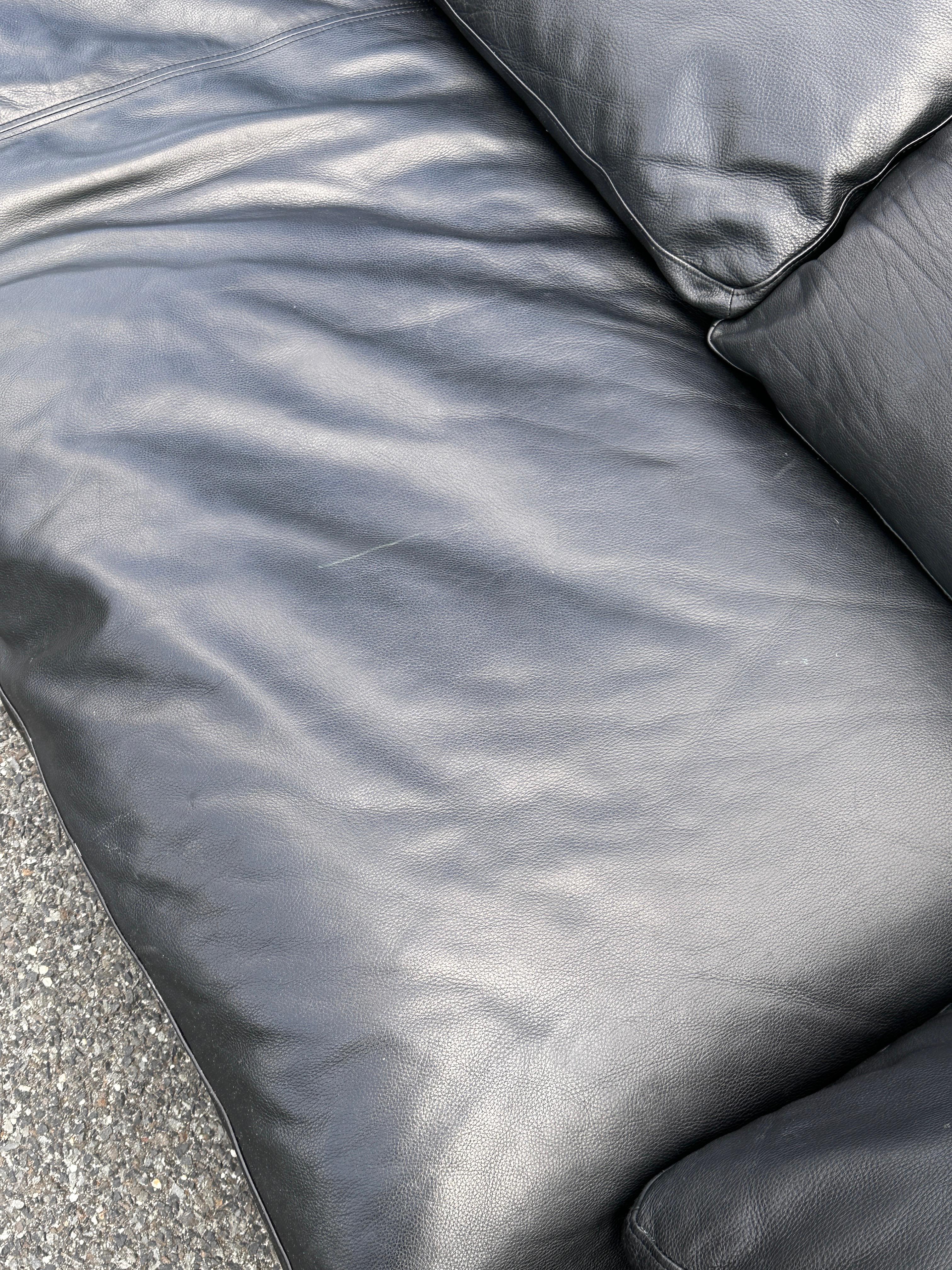 Extremely supple black leather, thick, durable, will wear like a baseball mitt. This couch has been vital and at the top of decorators lists for a decade, because of how comfortable it is. This is in the ‘luxe’ ultra-deep depth 45” width. Basically