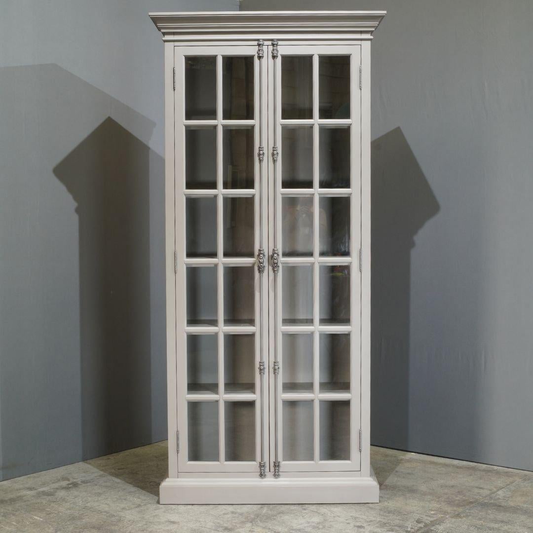 The Restoration Hardware French Casement Four Door Cabinet is a refined fusion of classic French design and modern functionality. Inspired by 19th-century windows, this stately piece features glass-paneled doors set within a solid oak frame,