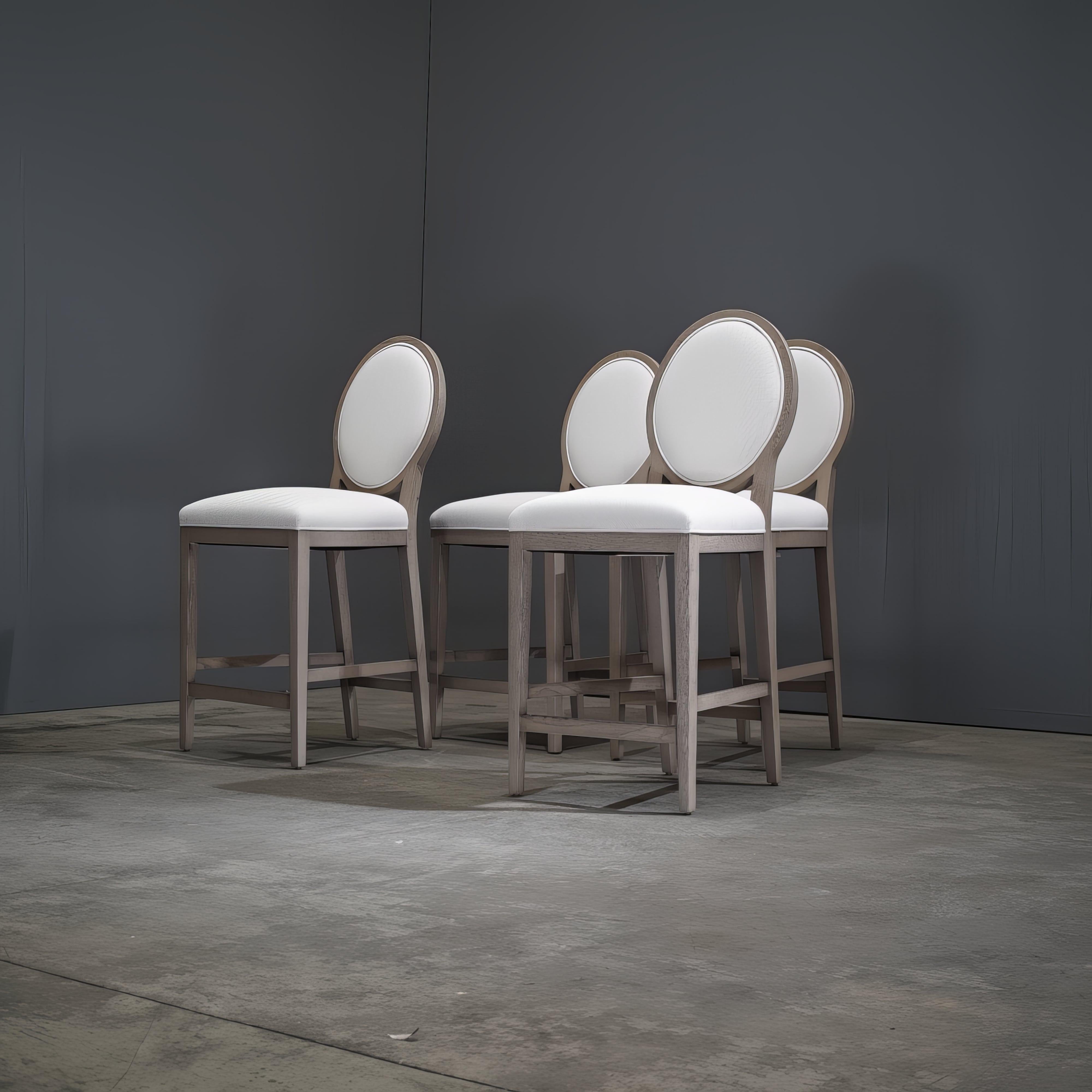 Elegance and modern design unite in the Restoration Hardware French Contemporary Round Fabric Counter Stool. This exquisite stool is upholstered in luxurious fabric, offering a plush and comfortable seating experience. Its subtly curved backrest