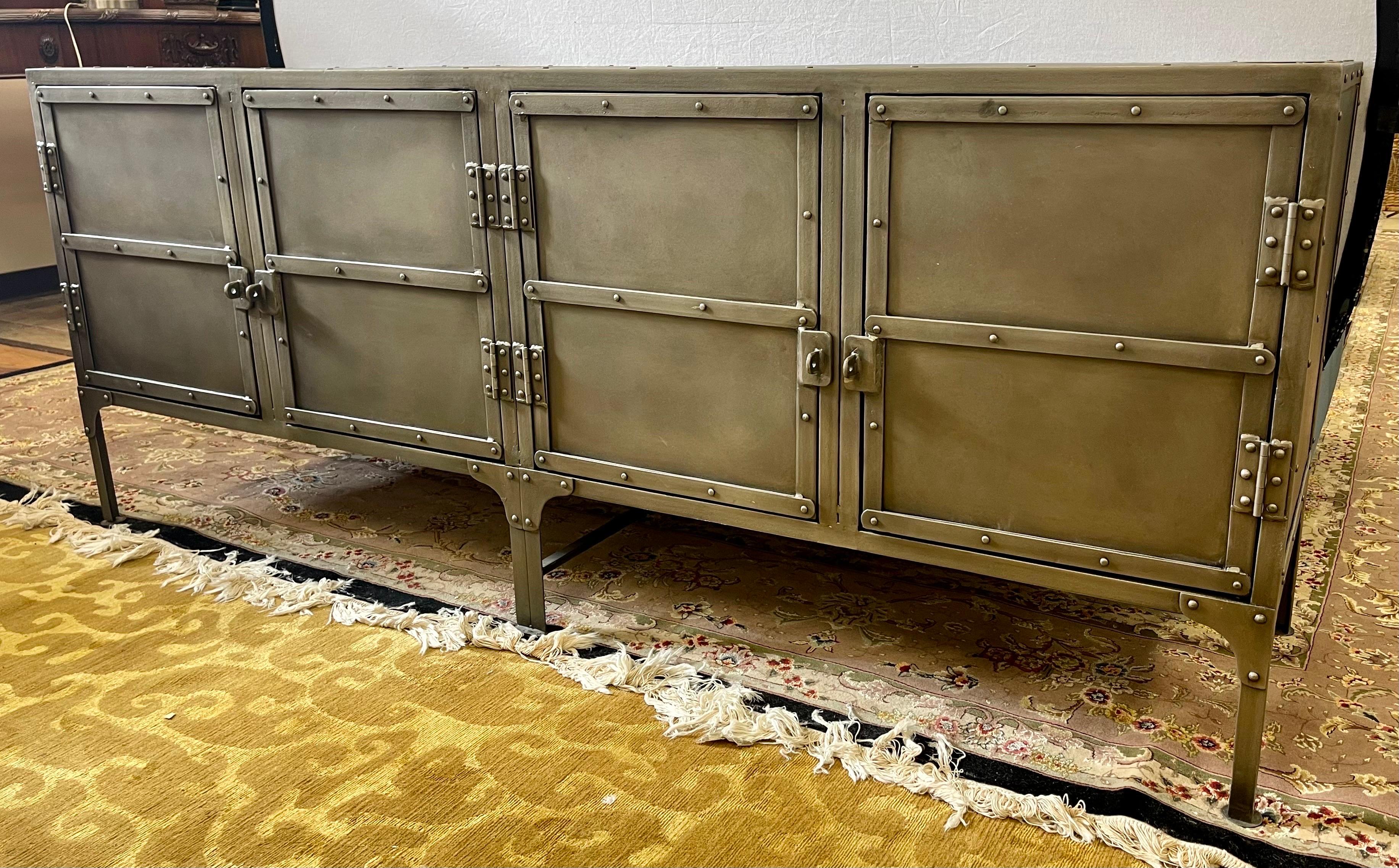 A circa 1900 toolbox from a French automobile factory inspired industrial
style cabinet perfectly suited to life as a console or sideboard today.

Handcrafted of iron and held with exposed rivets
A hand-applied, 4-step finishing process lends it