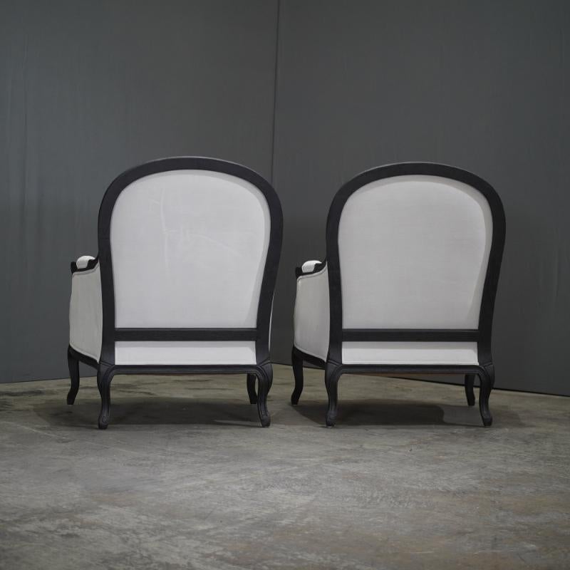 The Restoration Hardware Lyon Chair with Fabric Padding embodies a harmonious blend of traditional craftsmanship and modern sophistication. Meticulously constructed from solid oak, its frame boasts elegant curves and fluted detailing, exemplifying