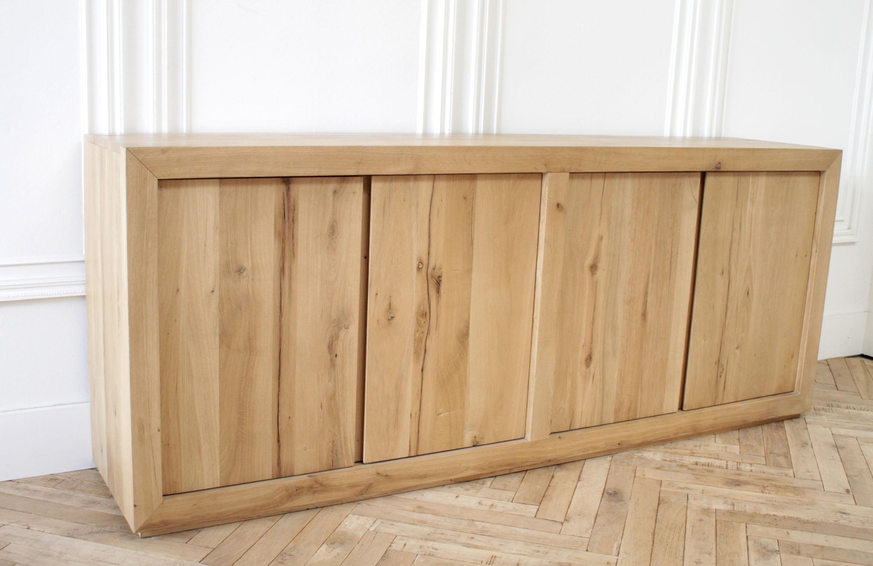 Handcrafted of solid reclaimed white oak timbers from decades-old buildings, our sideboard from artisan Theo Eichholtz is simple and functional in design. A salute to clean and contemporary style, each piece celebrates the unadorned beauty of