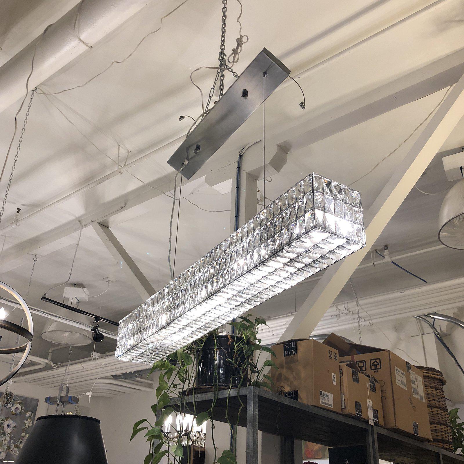 Presents this stunning restoration hardware spiridon linear chandelier. Mirroring the luxe design of 1960s Austrian lighting, the fixture's faceted crystals are hand-set within a matte iron frame and suspended from slender wires. Bring all your