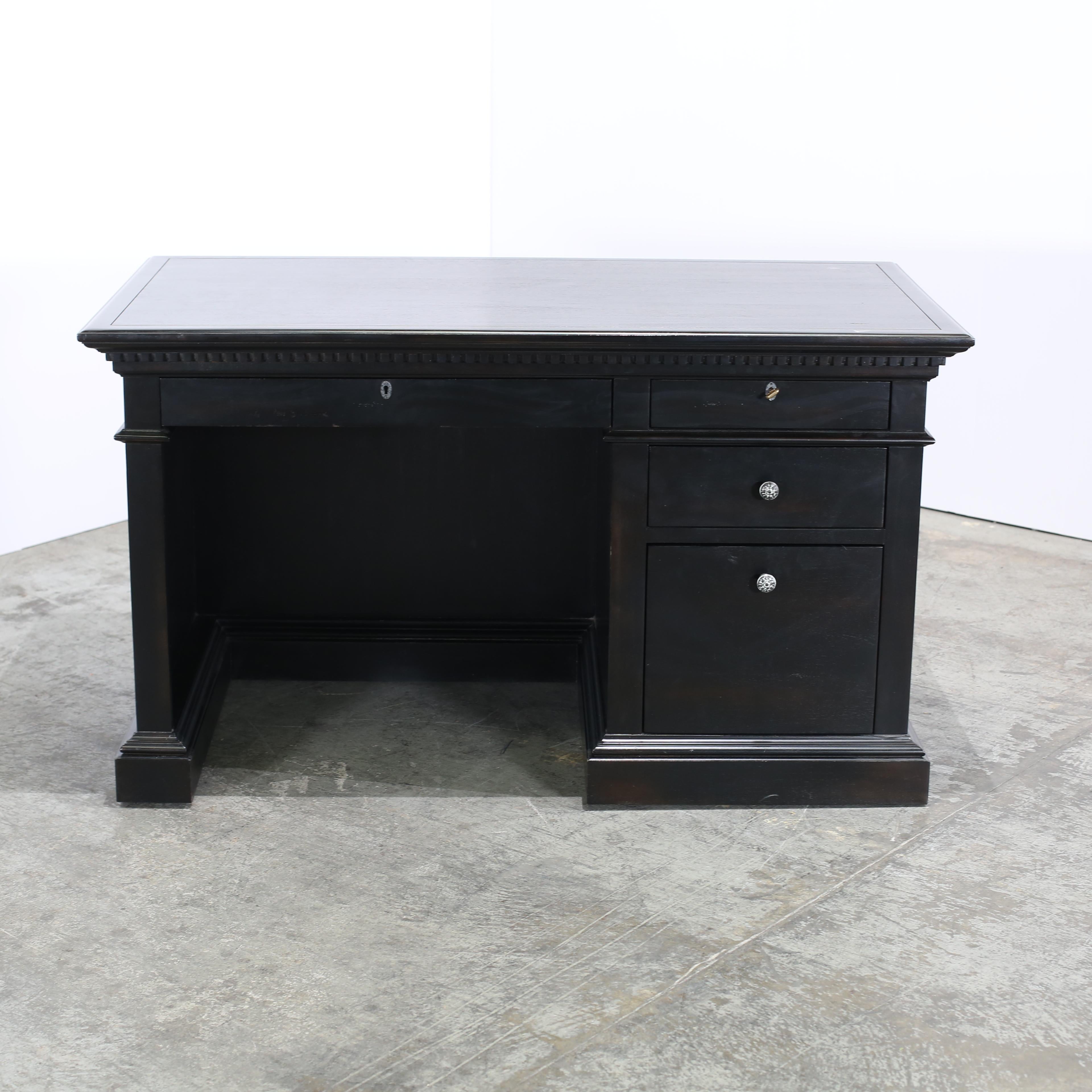 Introducing the St. James Four Drawer Desk by Restoration Hardware, a luxurious addition to any home office or study space. Crafted with meticulous attention to detail, this desk features four spacious drawers for ample storage and organisation. The