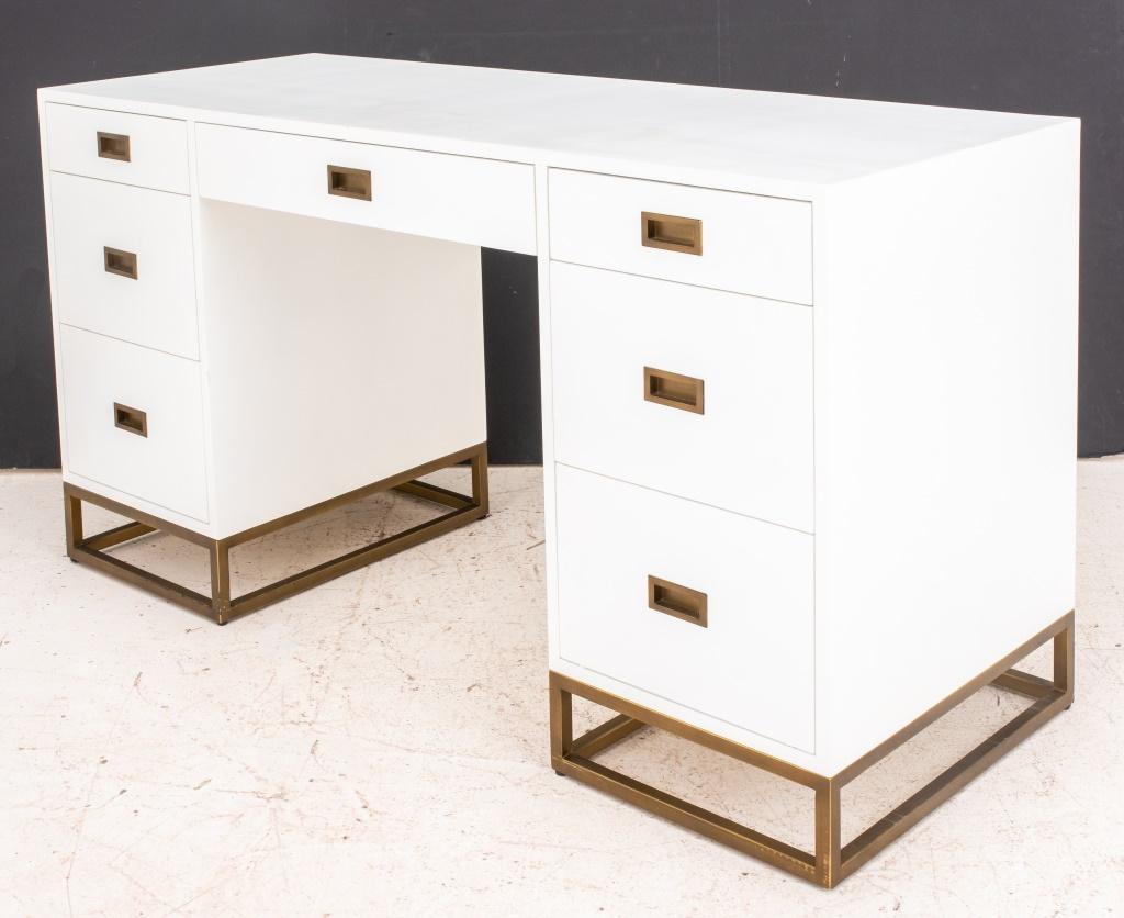 Restoration Hardware white lacquered wood desk, having seven drawers with gilt metal handles, raised on gilt metal base. Measures: 30.5