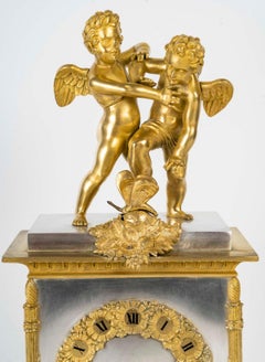 Reloj de época de restauración en bronce dorado y plateado, S. XIX.