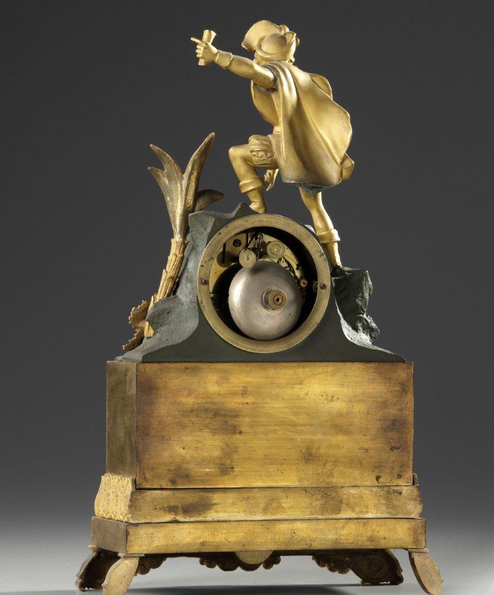 Restoration period gilt bronze clock
representing a man in period costume
Period : 19th century
Measures: Width : 23 cm
Height : 37 cm.