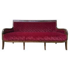 Restoration period settee in mahogany and red velvet