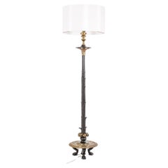 Restoration style floor lamp in bronze with two patinas. Circa 1900.