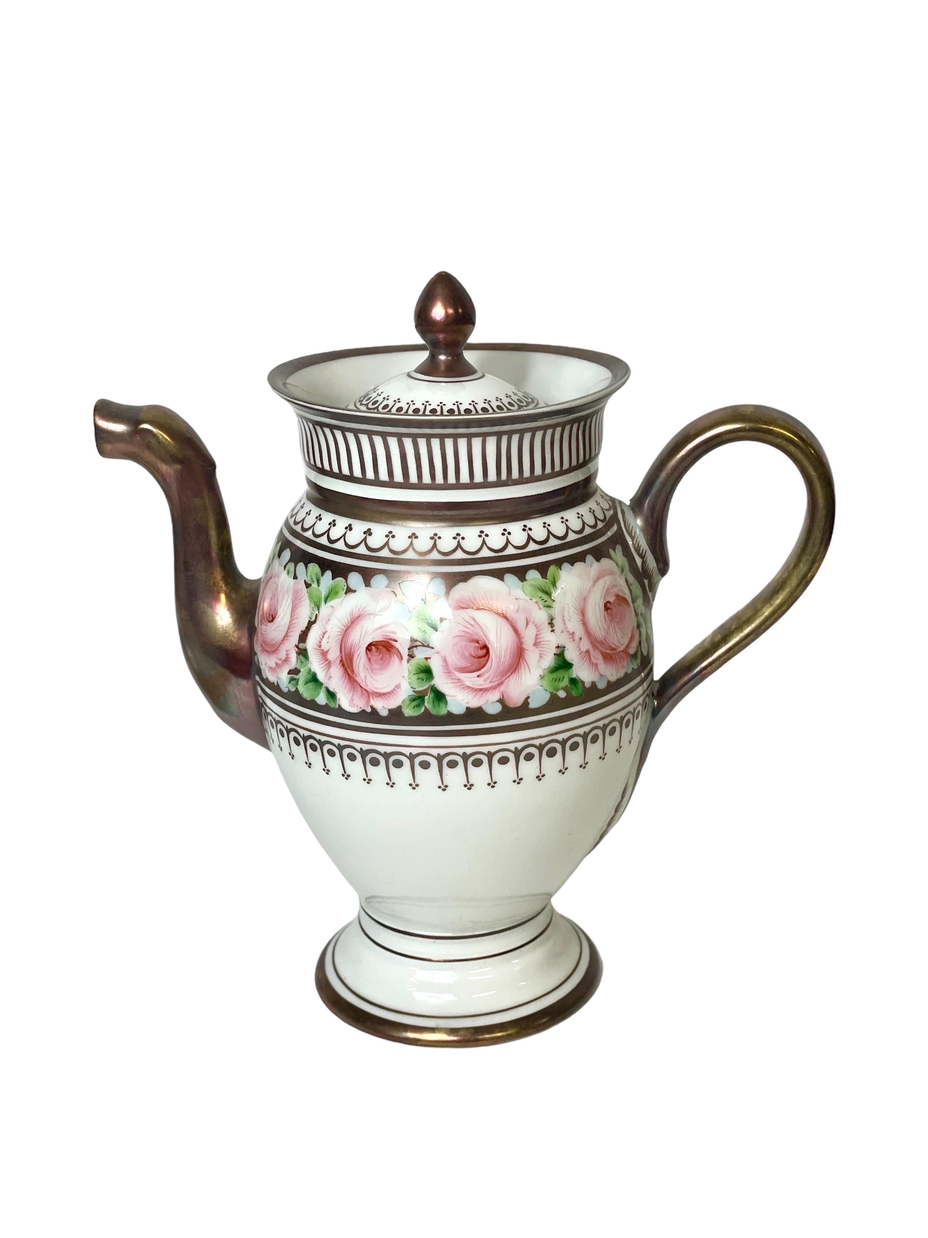 A stunning French Empire style coffee service, dating from around 1950, and comprising a coffee pot, six cups and saucers, a lidded sugar bowl and a cream jug. Crafted from white and silvered porcelain, each piece features a polychrome decoration of