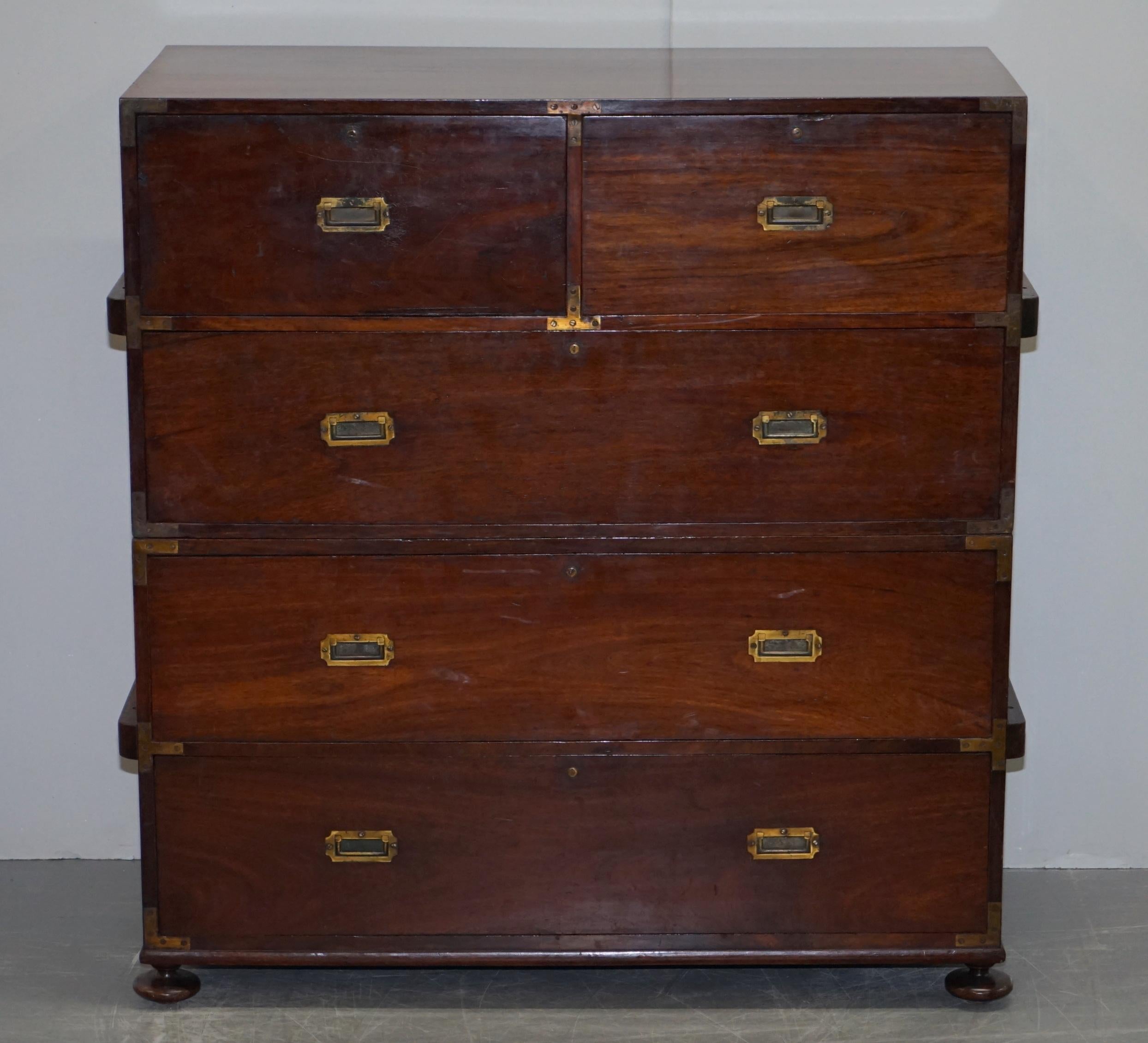 We are delighted to offer for salethis very rare original Camphor wood military campaign chest with sliding Secrataire desk and writing slope each lock numbered and stamped Stamford Co Feb 1 76 that has been lightly restored 

A very rare and