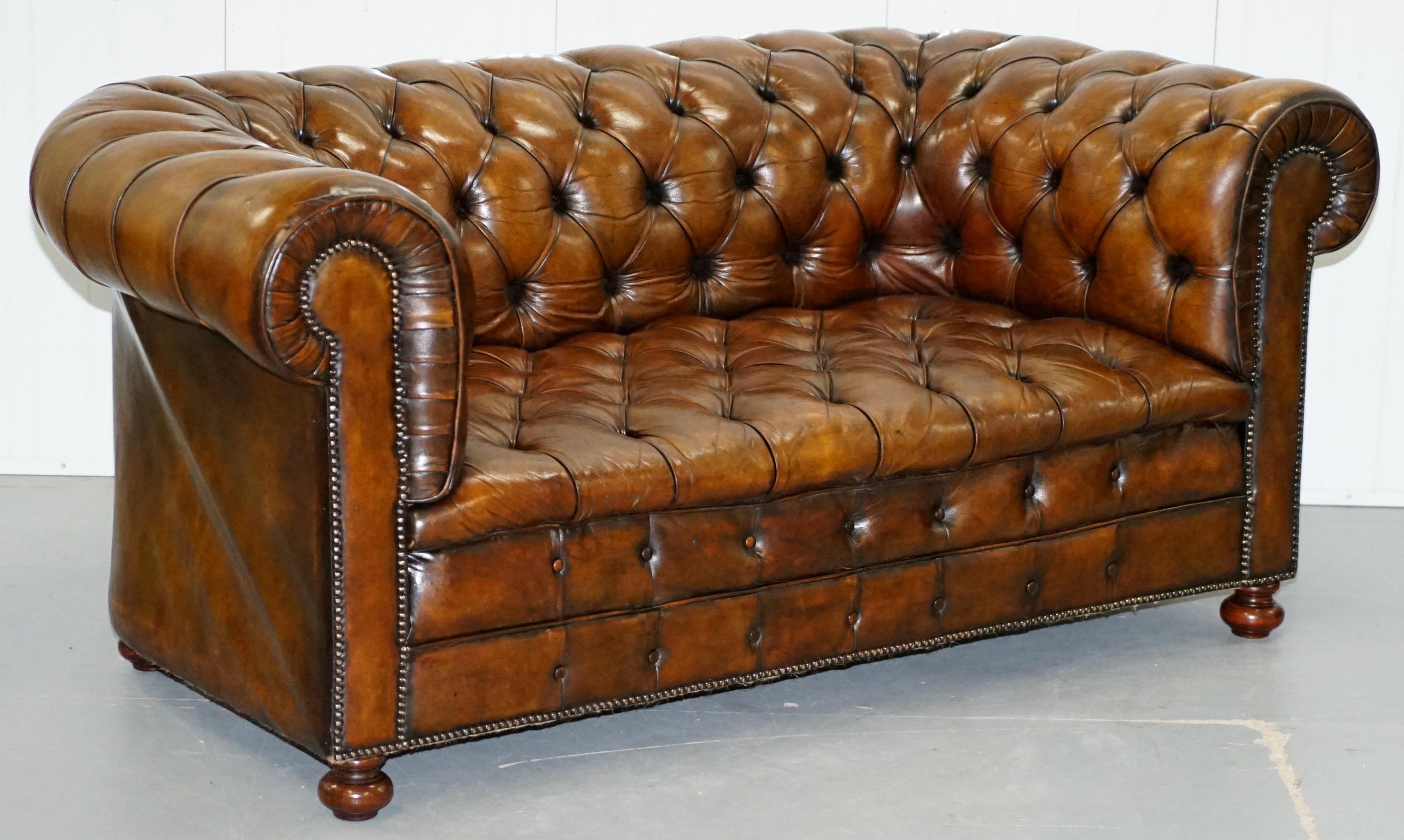 We are delighted to offer for sale this stunning fully restored circa 1900 hand dyed Whiskey brown leather sofa with original horse hair padding and coil sprung front edge 

The sofa has been fully restored to include having the old colour