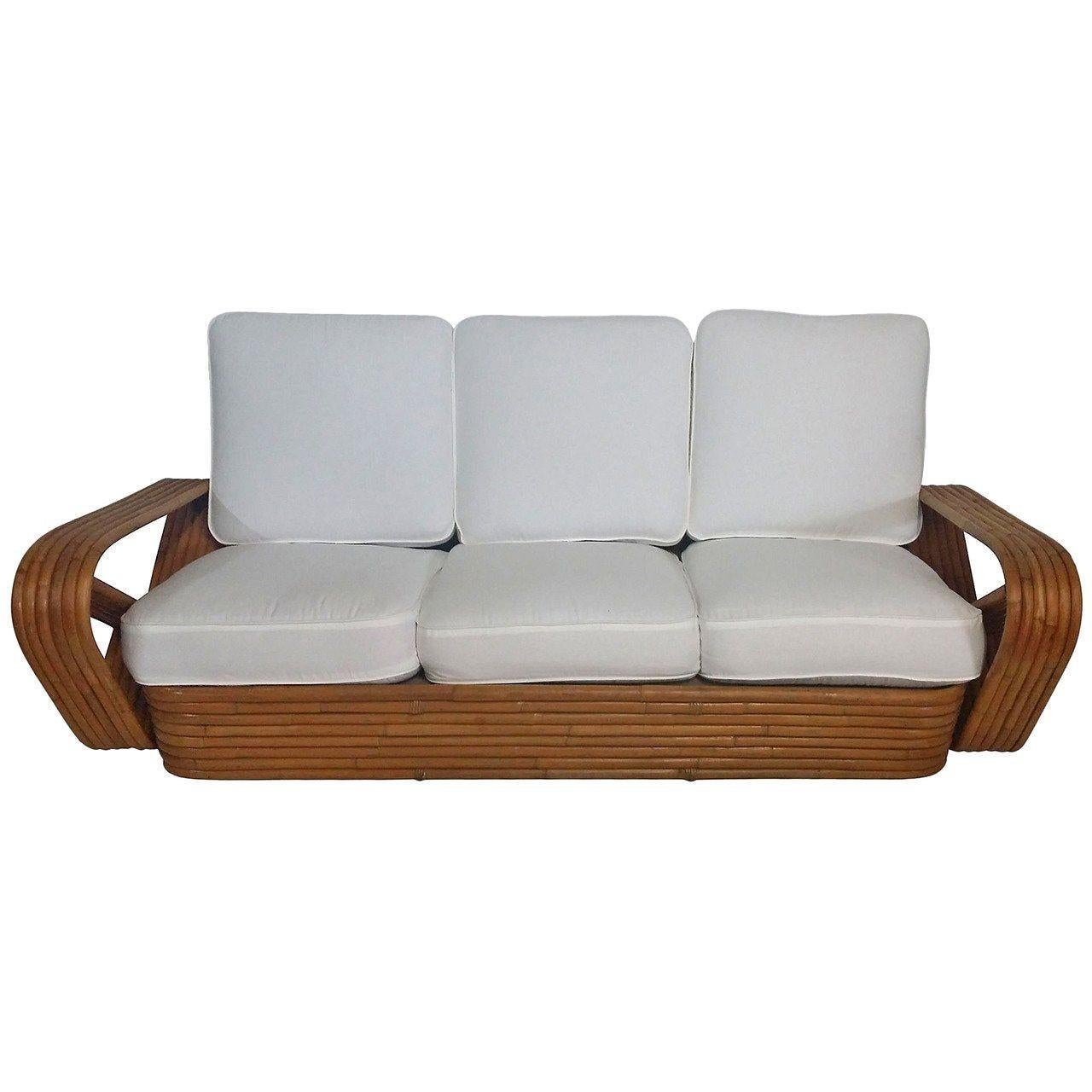 Original rattan six-strand square pretzel arm three-seat sofa with a wonderfully stacked rattan base and white covered cushions,

1930, United Staes
 
We we only purchase and sell only the best and finest rattan furniture made by the best and most