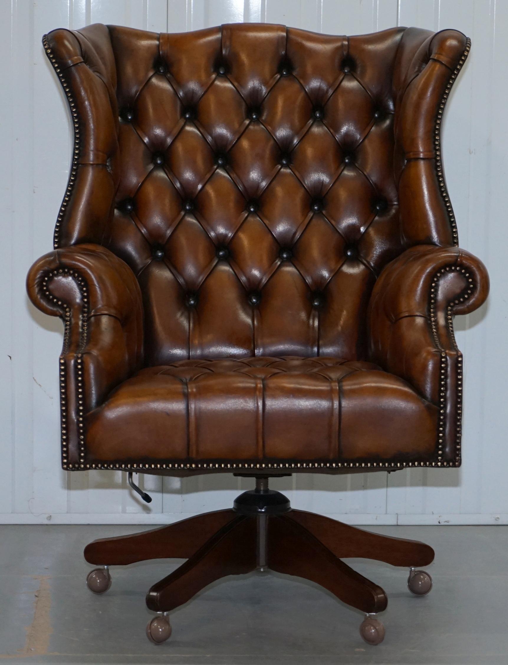 We are delighted to offer for sale this stunning very rare original circa 1940s hand dyed fully restored cigar brown leather Chesterfield fully buttoned wingback directors captains chair

This is the bosses chair, the executive director, there are