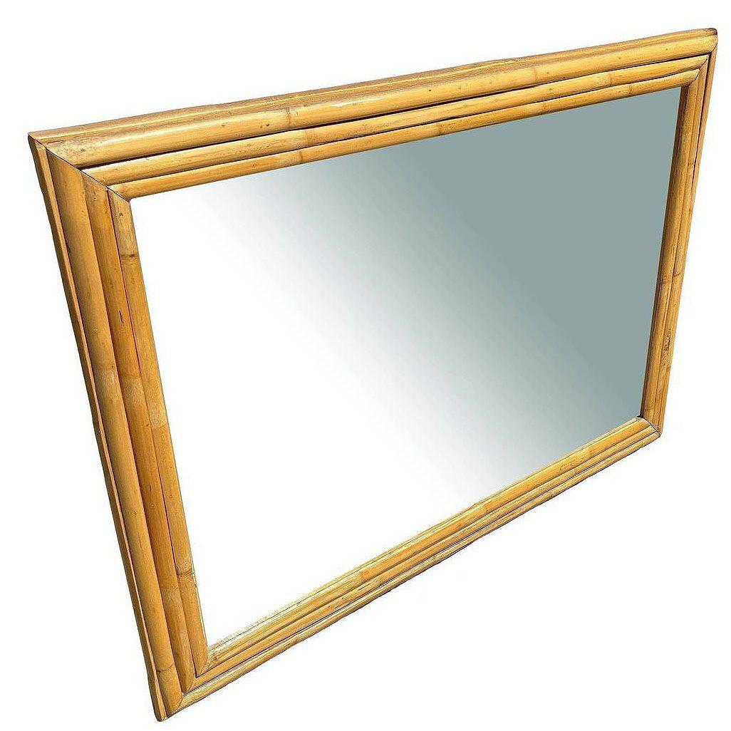 This beautifully restored vintage rattan wall mirror features a bold 3-inch, 3-strand rattan frame that adds natural texture and warmth. It is meticulously refinished, blending style and vintage charm with modern comfort.. It is perfect for creating