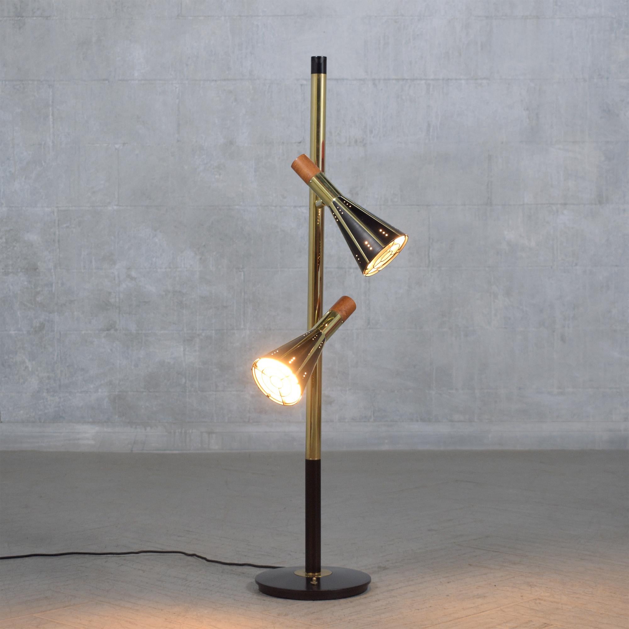 Experience the timeless elegance of our modern vintage 1960 floor lamp, skillfully restored to its original splendor. Composed of brass, wood, and metal, this exquisite lamp has been carefully rejuvenated by our expert in-house craftsmen. Now fully