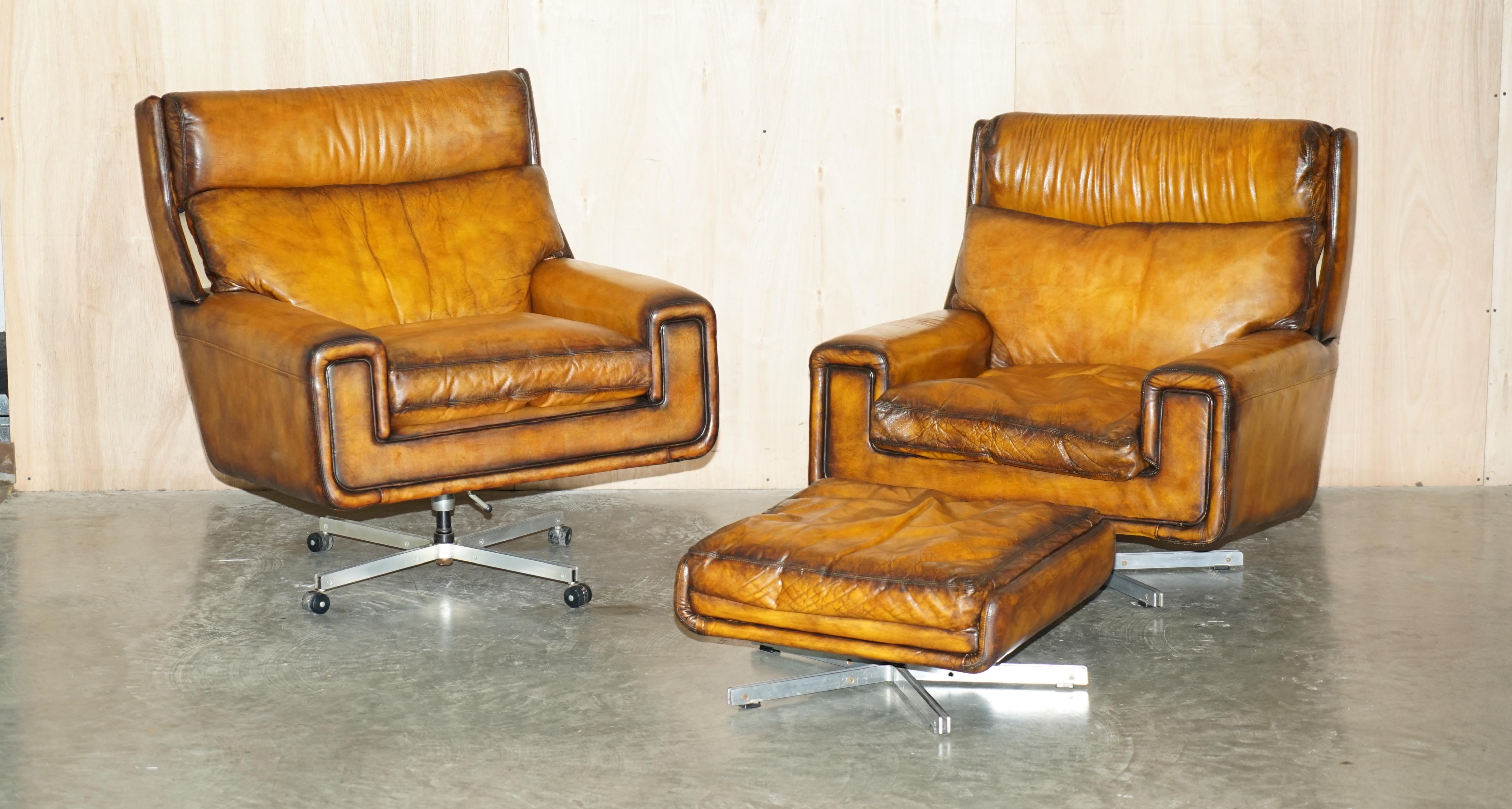 We are delighted to offer for sale this stunning fully restore vintage circa 1970's hand dyed Whisky brown leather swivel armchair with matching ottoman which is part of a small suite 

Please note the delivery fee listed is just a guide, it