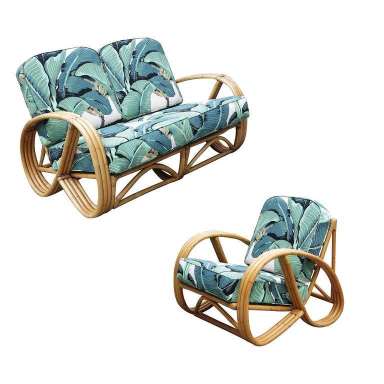 This round 3/4 pretzel arm rattan lounge chair and three-strand round pretzel arm rattan loveseat and was professionally restored in 2019. 

This armchair and sofa pair dates from the 1940s with optional 